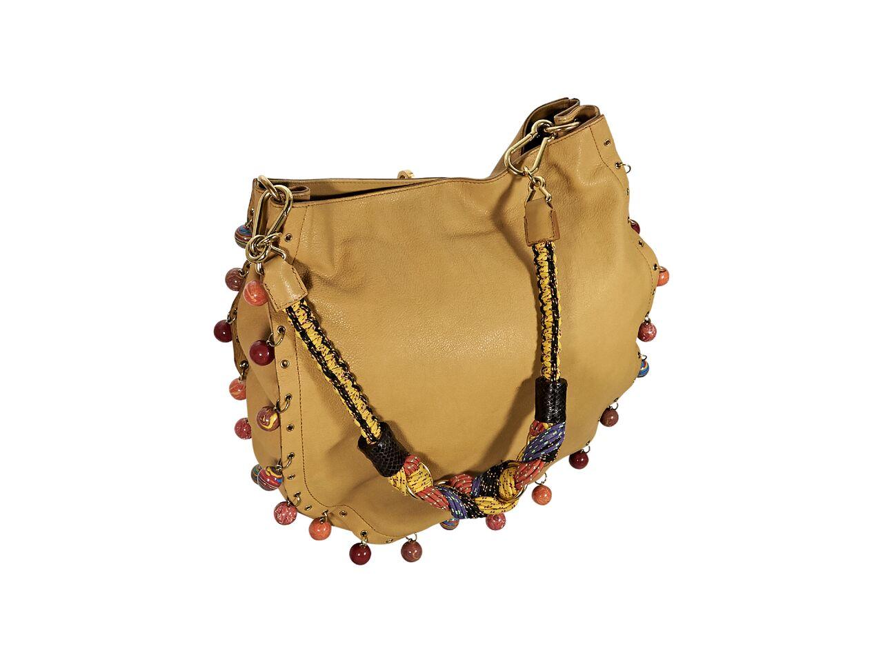Product details:  Tan leather shoulder bag by Marc Jacobs.  Trimmed with multicolor beads.  Detachable shoulder strap.  Concealed magnetic snap closure.  Goldtone hardware.  13