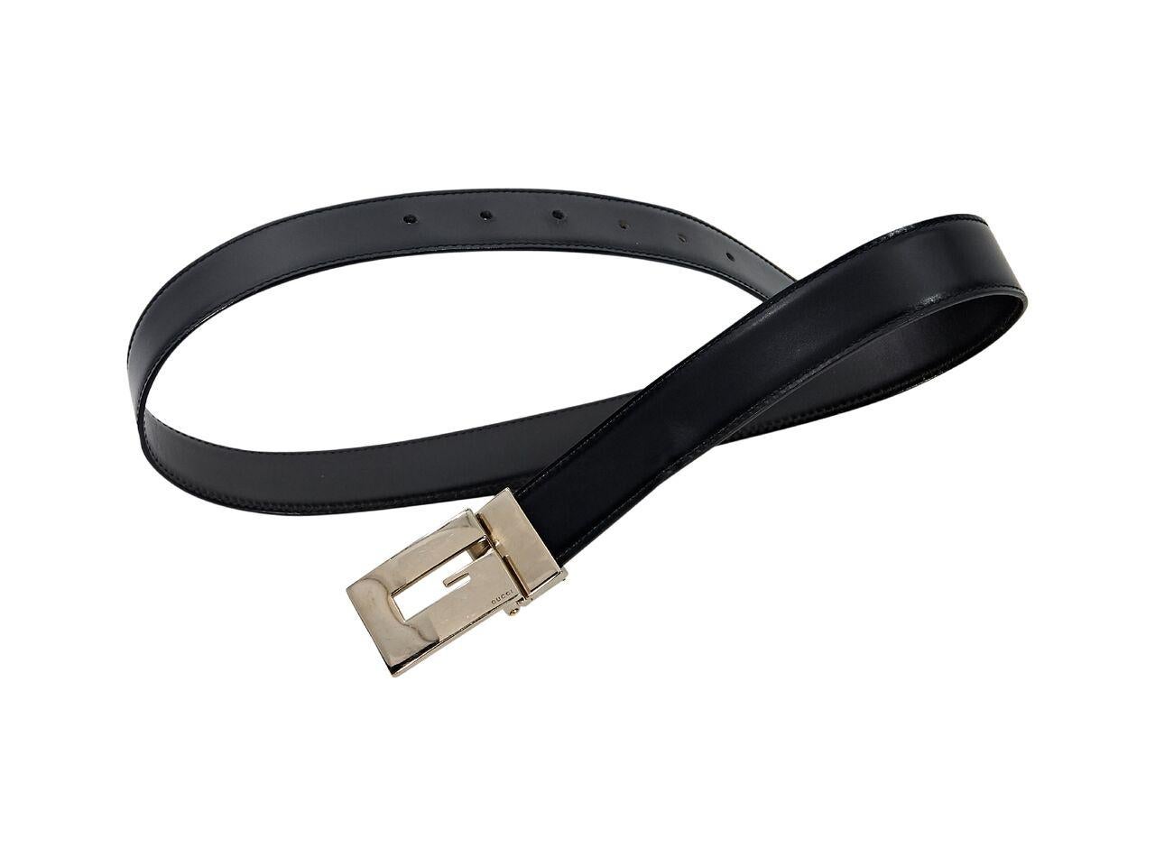Product details:  Black leather belt by Gucci.  Adjustable square 'G' buckle.  Silvertone hardware.  35
