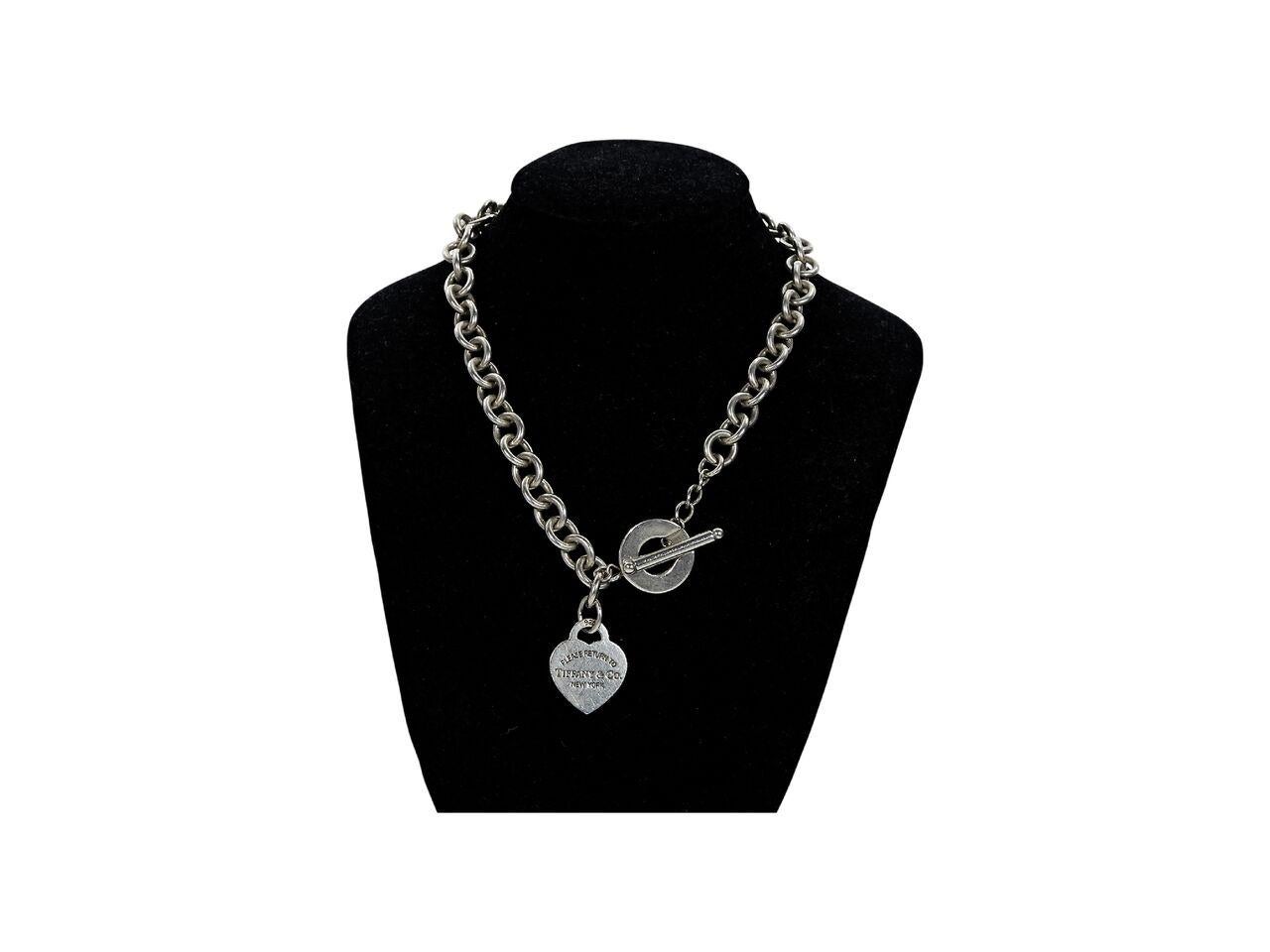 Product details:  Sterling silver heart tag choker necklace by Tiffany & Co.  Toggle closure.  16