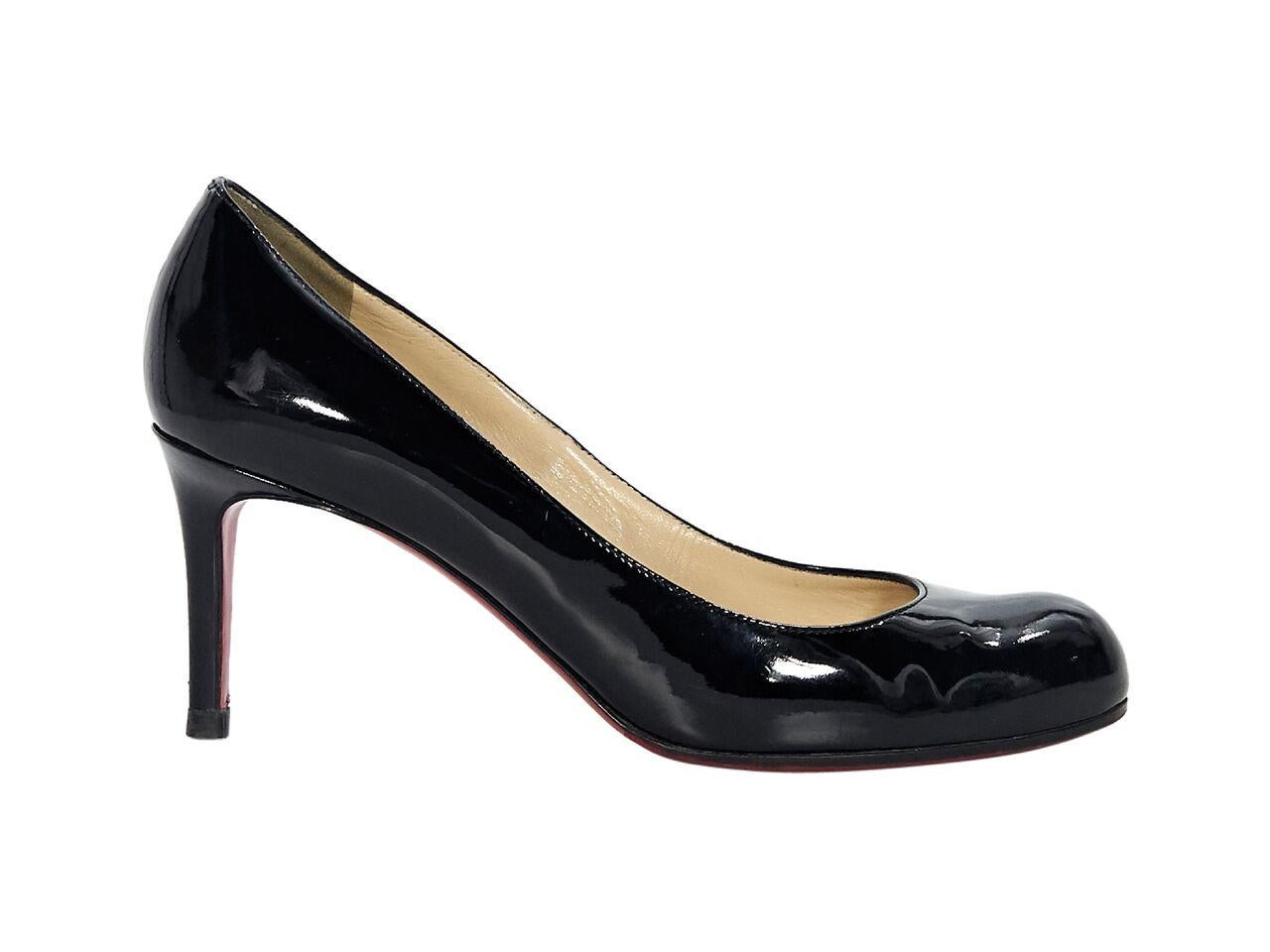 Product details:  Black patent leather pumps by Christian Louboutin.  Round toe.  Iconic red sole.  Slip-on style.  3