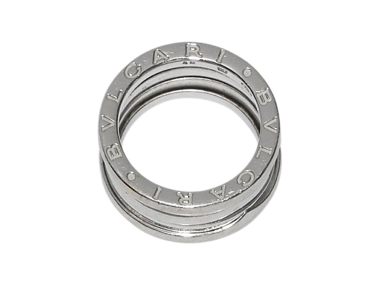 Product details:  18K white gold B.zero1 ring by Bulgari.  Engraved logo design. Size 3.75.
Condition: Pre-owned. Very good. 
Est. Retail $ 2,500.00