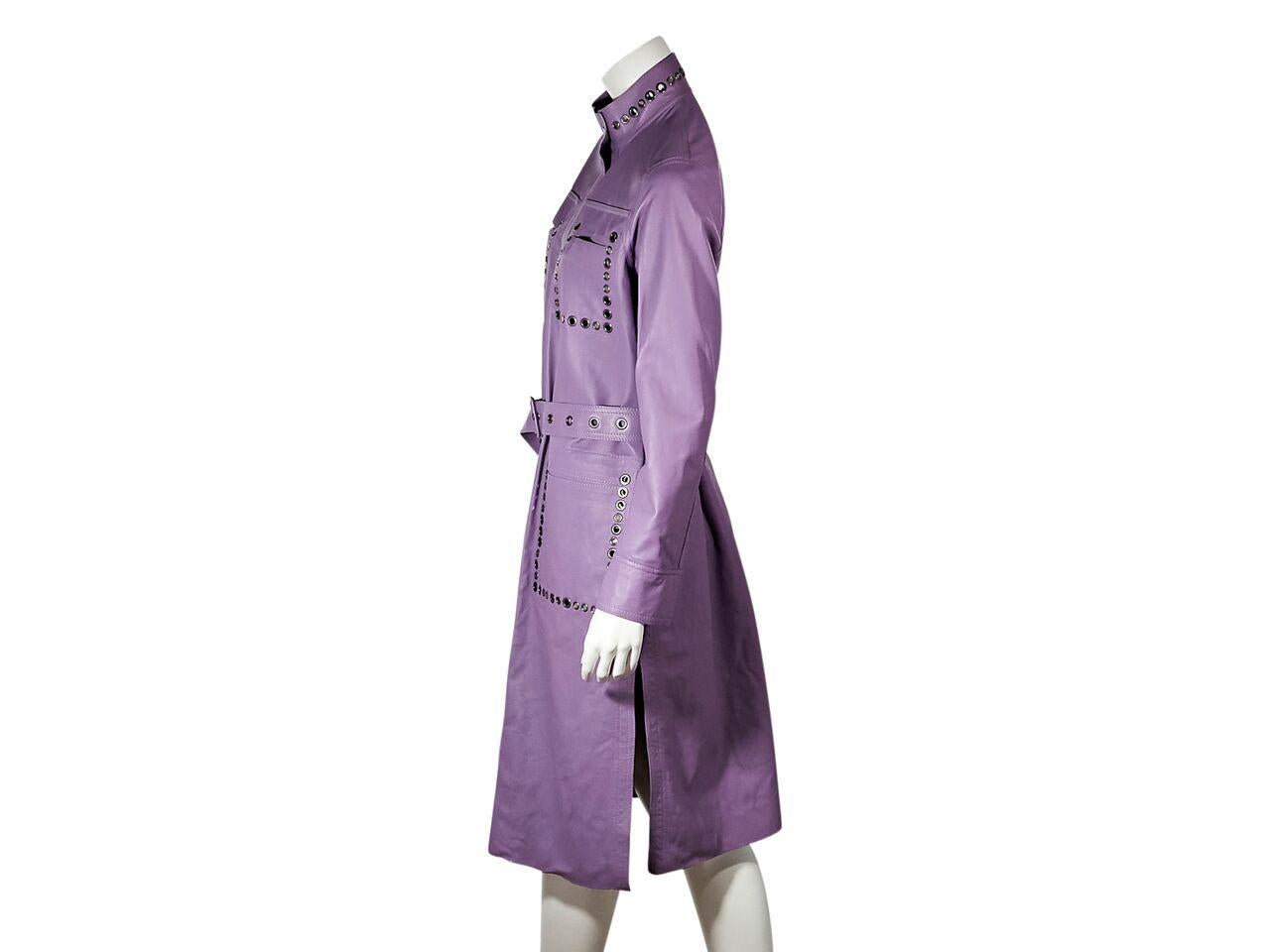 Product details:  Purple suede and leather reversible coat by Bottega Veneta.  From the SS '18 collection.  Accented with grommets.  Stand collar.  Long sleeves.  Snap-front closure.  Adjustable belted waist.  Flap front pockets.  Reversible side