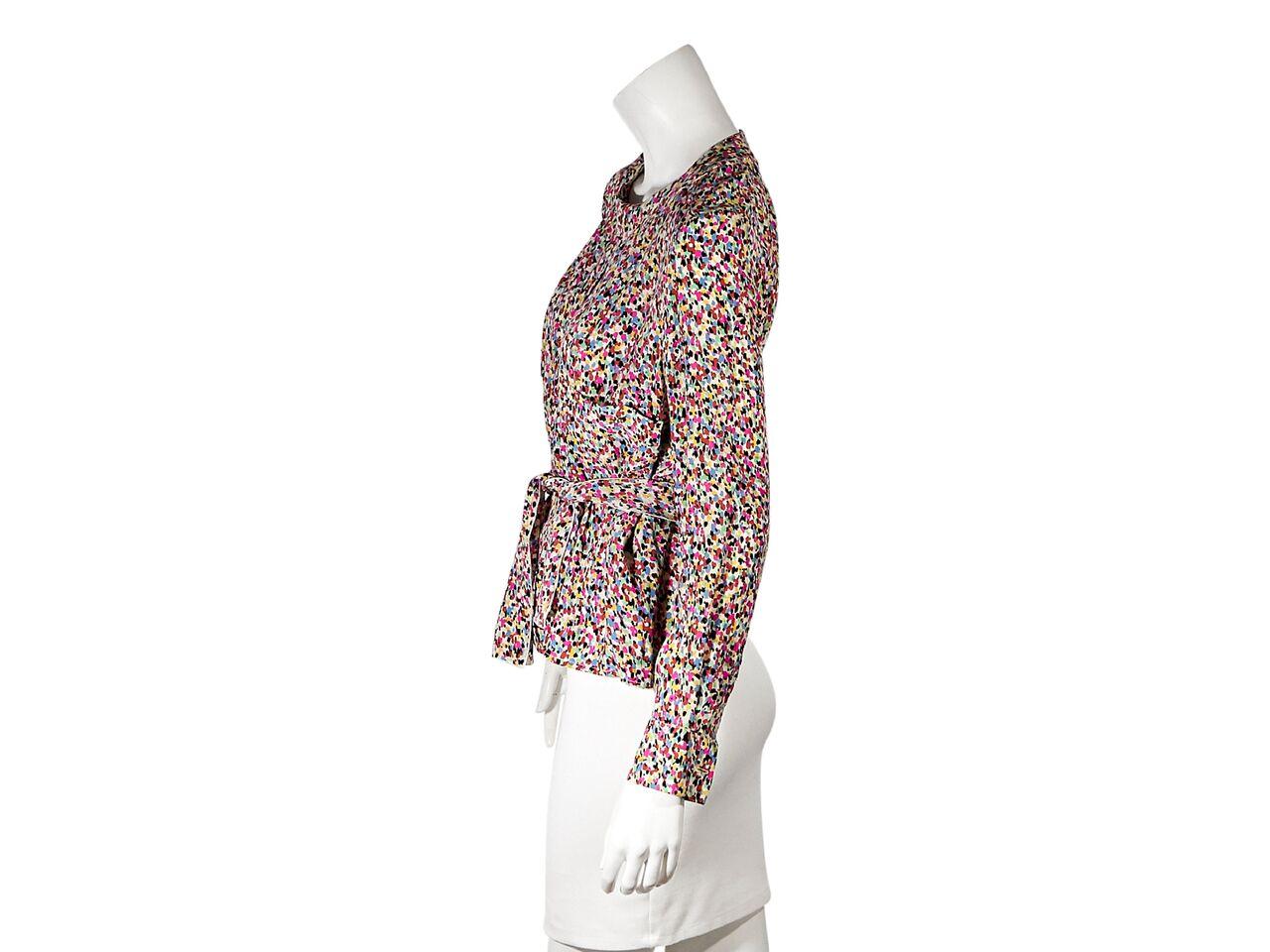 Product details:  Vintage multicolor ditzy-print blouse by Chanel.  Jewelneck.  Long sleeves.  Single button cuffs.  Self-tie belted waist.  Button-back closure.  Bust 40