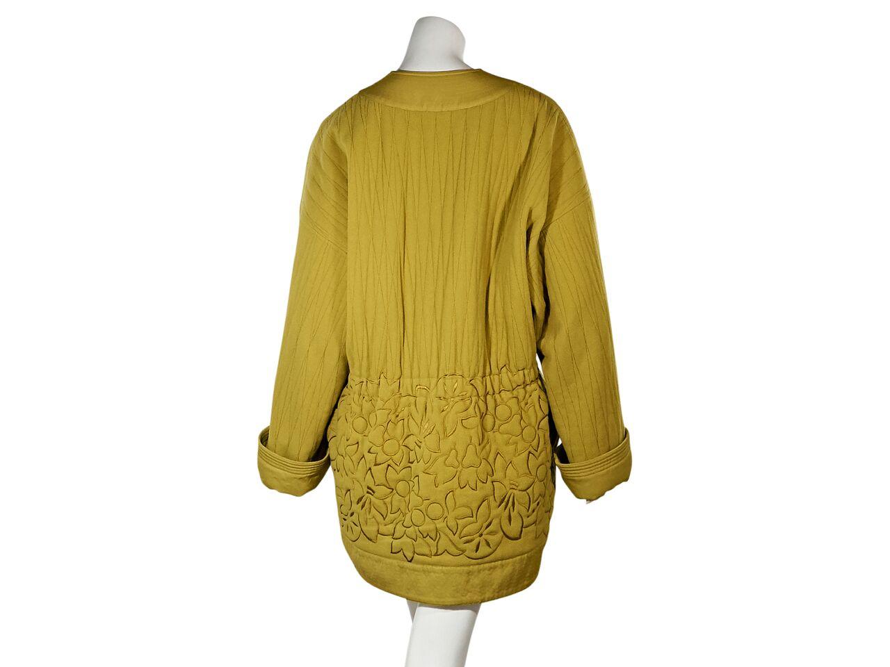 Product details:  Vintage mustard yellow jacket by Gianni Versace.  Accented with floral embroidery.  Split crewneck.  Long sleeves.  French cuffs.  Concealed zip-front closure.  Waist slide pockets.  46.5
