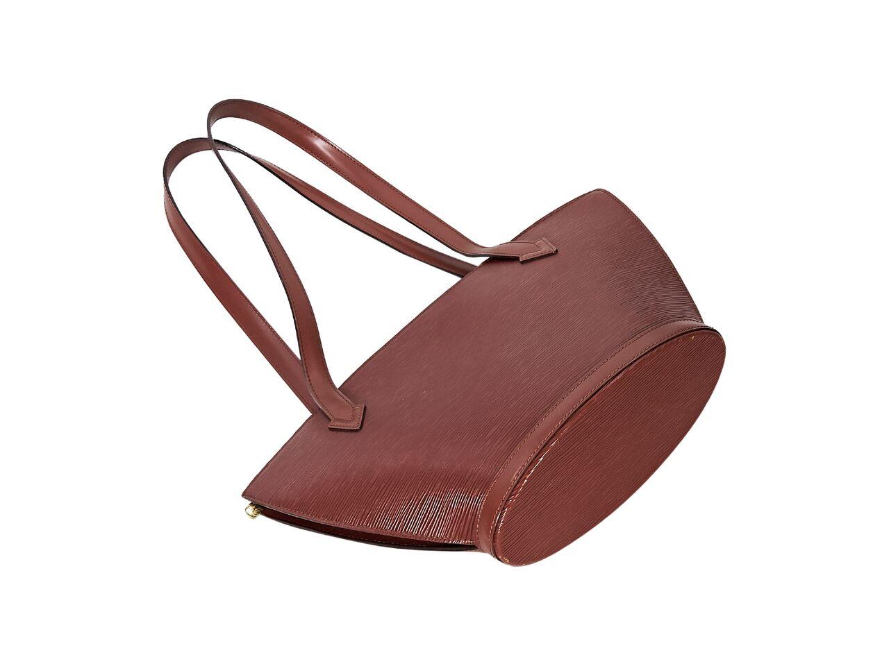 Product details:  Tan epi leather shoulder bag by Louis Vuitton.  Dual shoulder straps.  Top zip closure.  Lined interior with inner slide pocket.  Goldtone hardware.  13.5