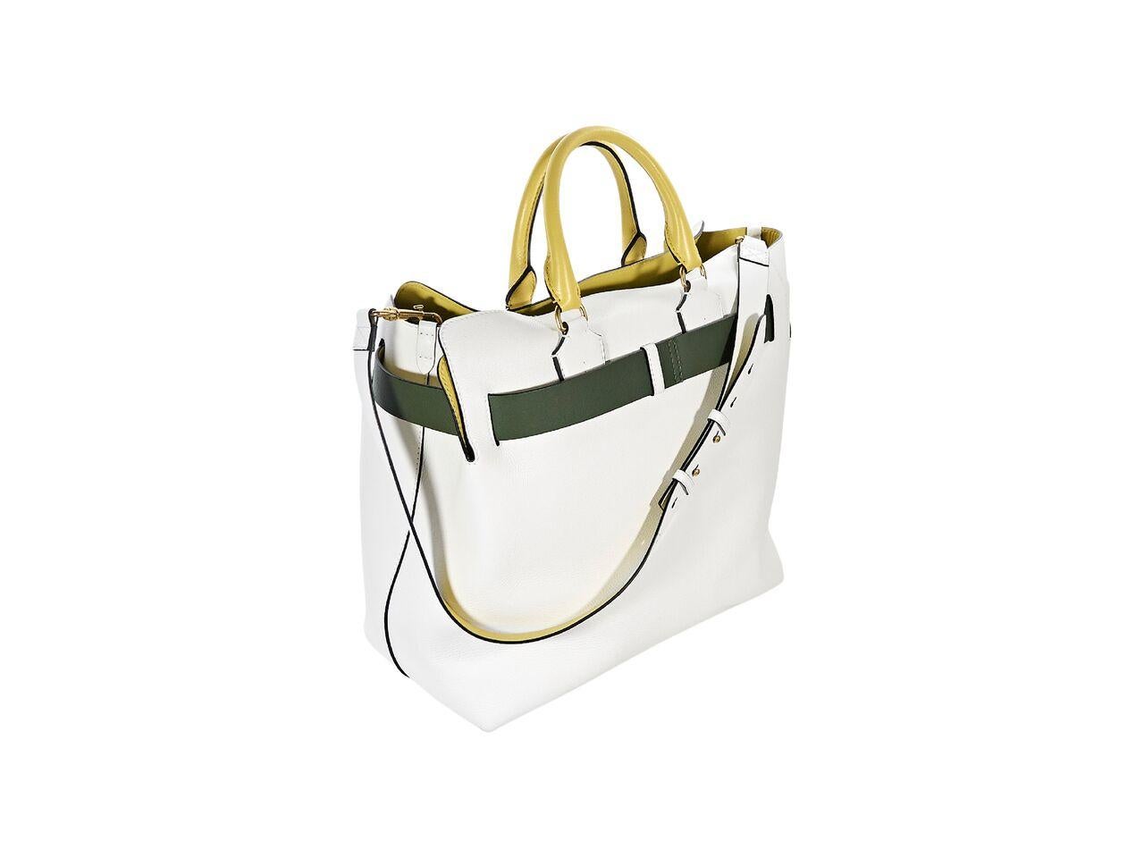 Product details:  Large white leather satchel by Burberry.  Dual yellow carry handles.  Detachable, adjustable shoulder strap.  Open top.  Inner slide pockets.  Removable green and white belt accents.  Protective metal feet.  Goldtone hardware. 
