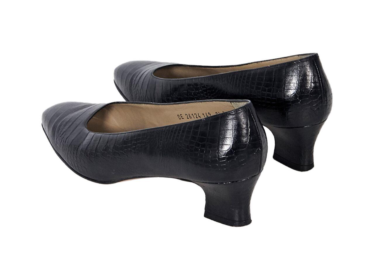 Product details:  Black embossed leather kitten heels by Salvatore Ferragamo.  Rounded square toe.  Slip-on style.  2