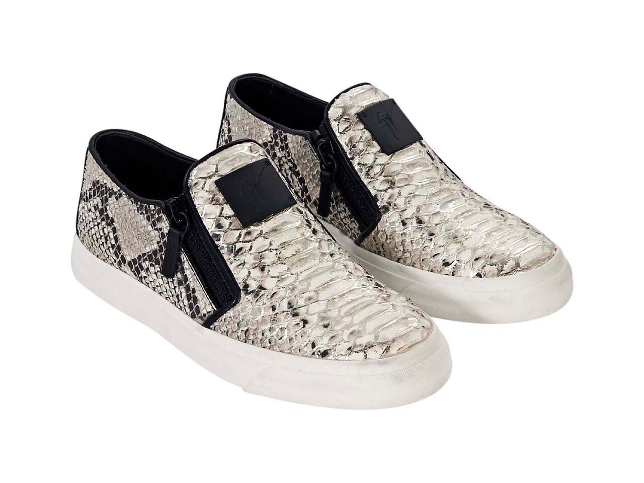 Product details:  Multicolor metallic snakeskin embossed sneakers by Giuseppe Zanotti.  Trimmed with black patent leather.  Zipper placket accents.  Round toe.  Slip-on style. 
Condition: Pre-owned. Very good. 
Est. Retail $ 995.00