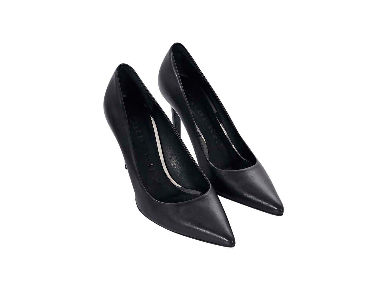 Product details:  Black leather pumps by Burberry.  Point toe.  Wooden stiletto heel.  Slip-on style.  3