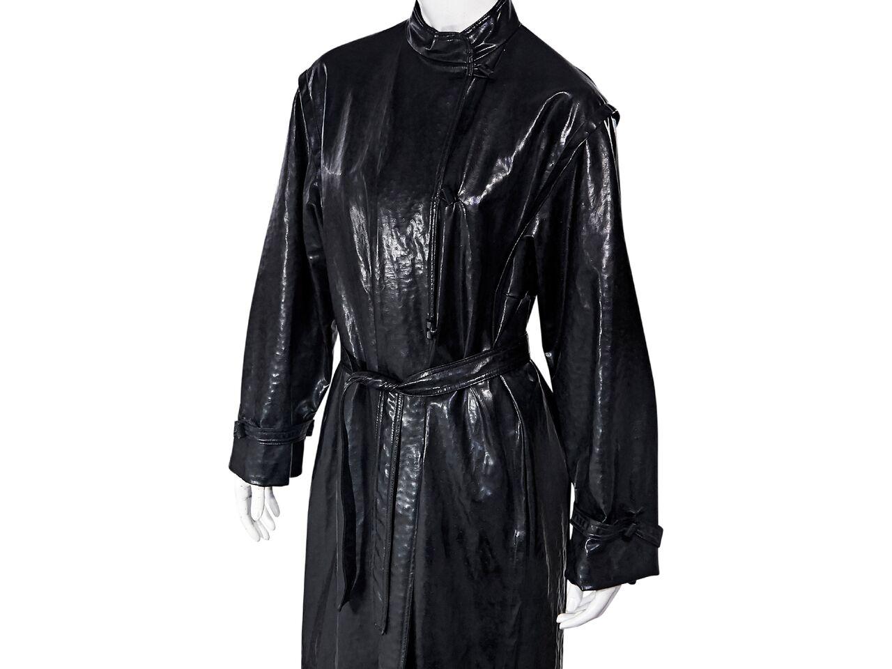 Product details:  Vintage black faux ostrich raincoat by Pierre Balmain.  Circa 1950s.  Stand collar.  Long sleeves.  Self-tie belted waist.  Label size FR 42.  45