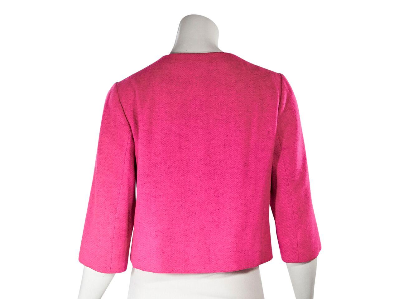 Product details:  Vintage hot pink cropped jacket by Balenciaga.  Roundneck.  Elbow-length sleeves.  Button-front closure.  Waist flap pockets.  38