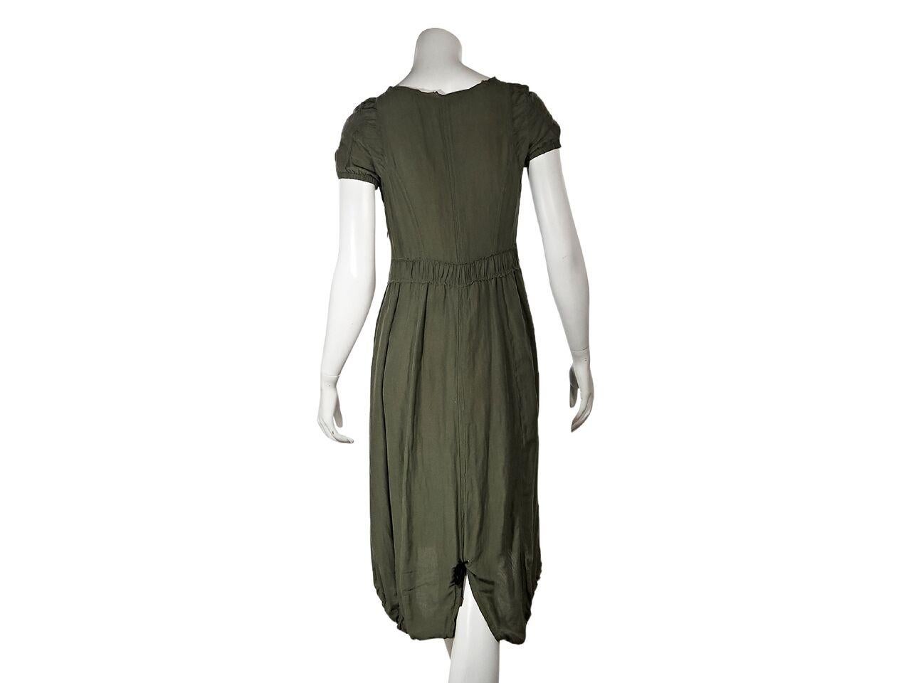 Product details:  Army green casual dress by McQ Alexander McQueen.  Scoopneck.  Short sleeves.  Elastic cuffs.  Concealed side zip closure.  Drawstring hem with center back slit.  27