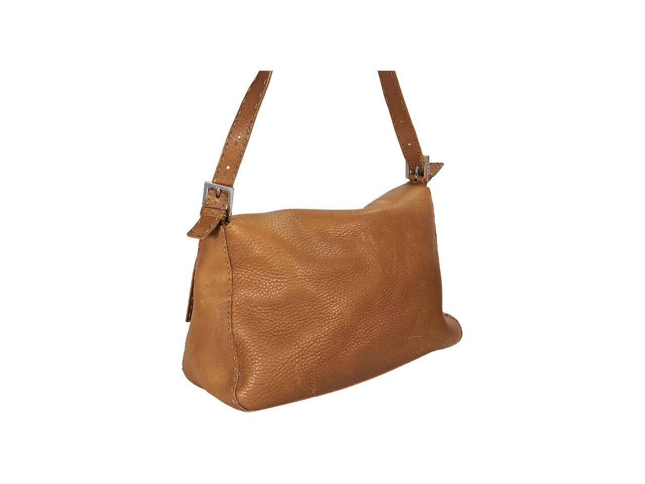 Product details:  Tan soft pebbled leather Selleria shoulder bag by Fendi.  Features topstitched trim.  Single shoulder strap.  Front flap.  Lined interior with inner zip pocket.  11.5