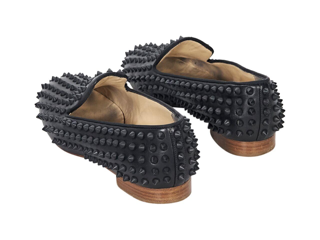 Product details:  Black leather studded loafers by Christian Louboutin.  Round toe.  Low stacked heel.  Iconic red sole.  Slip-on style. 
Condition: Pre-owned. Very good. 
Est. Retail $ 1,095.00