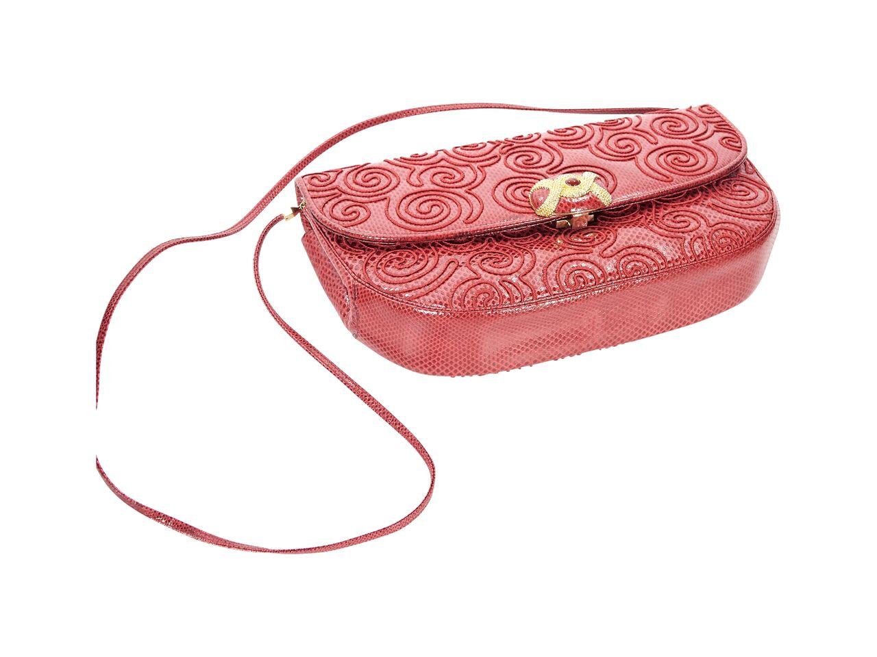 Product details:  Vintage red snake-embossed leather shoulder bag by Judith Leiber.  Tuck-away shoulder strap.  Front flap with clasp closure.  Lined interior with inner zip and slide pockets.  Goldtone hardware.  11.25