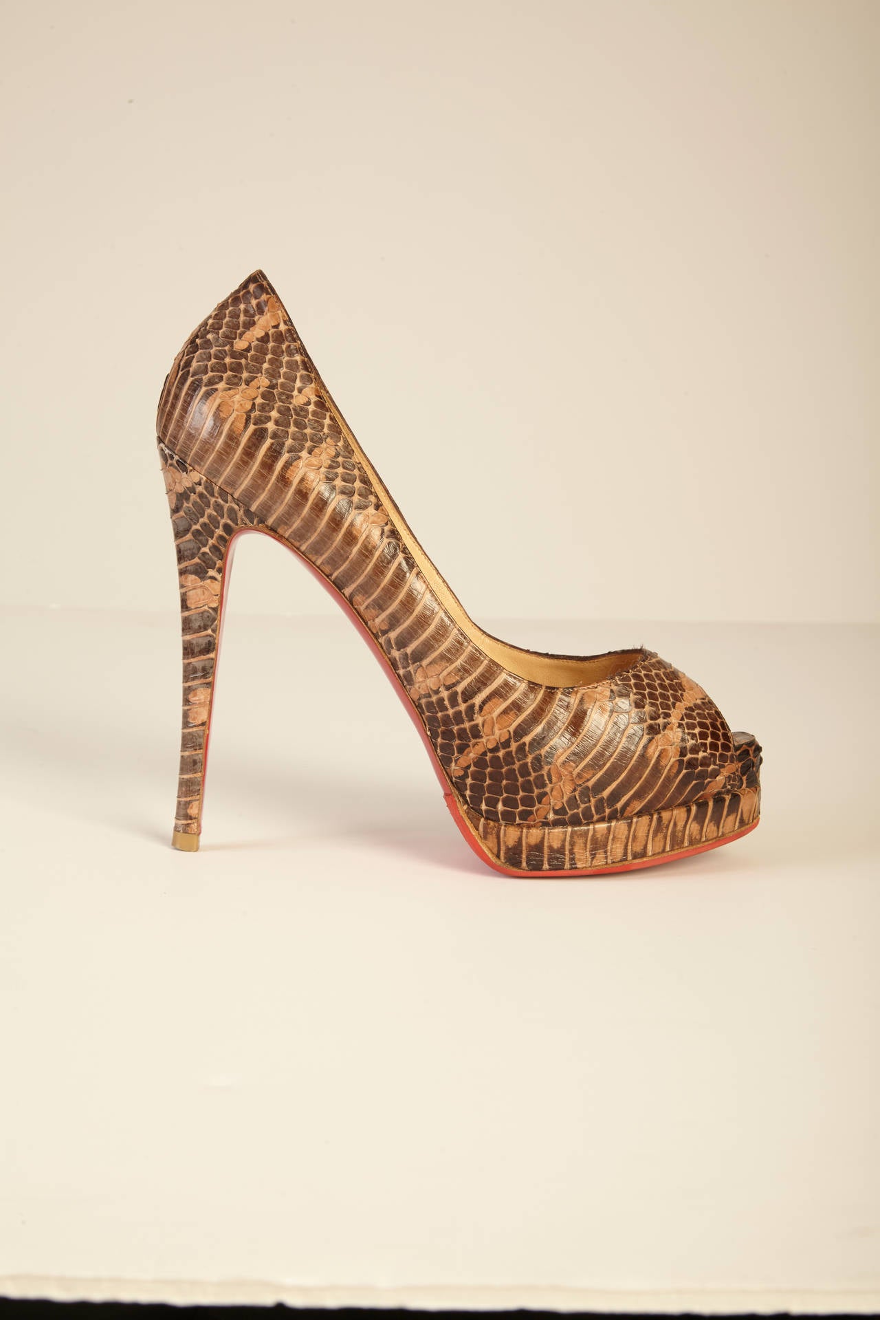 Sleek, sophisticated, and fierce - all in one pair of shoes! These gorgeous, python pumps will add a dash of beauty and excitement to any simple wardrobe, and are certainly the ideal combination of edge and classiness. Bottom of shoe has been