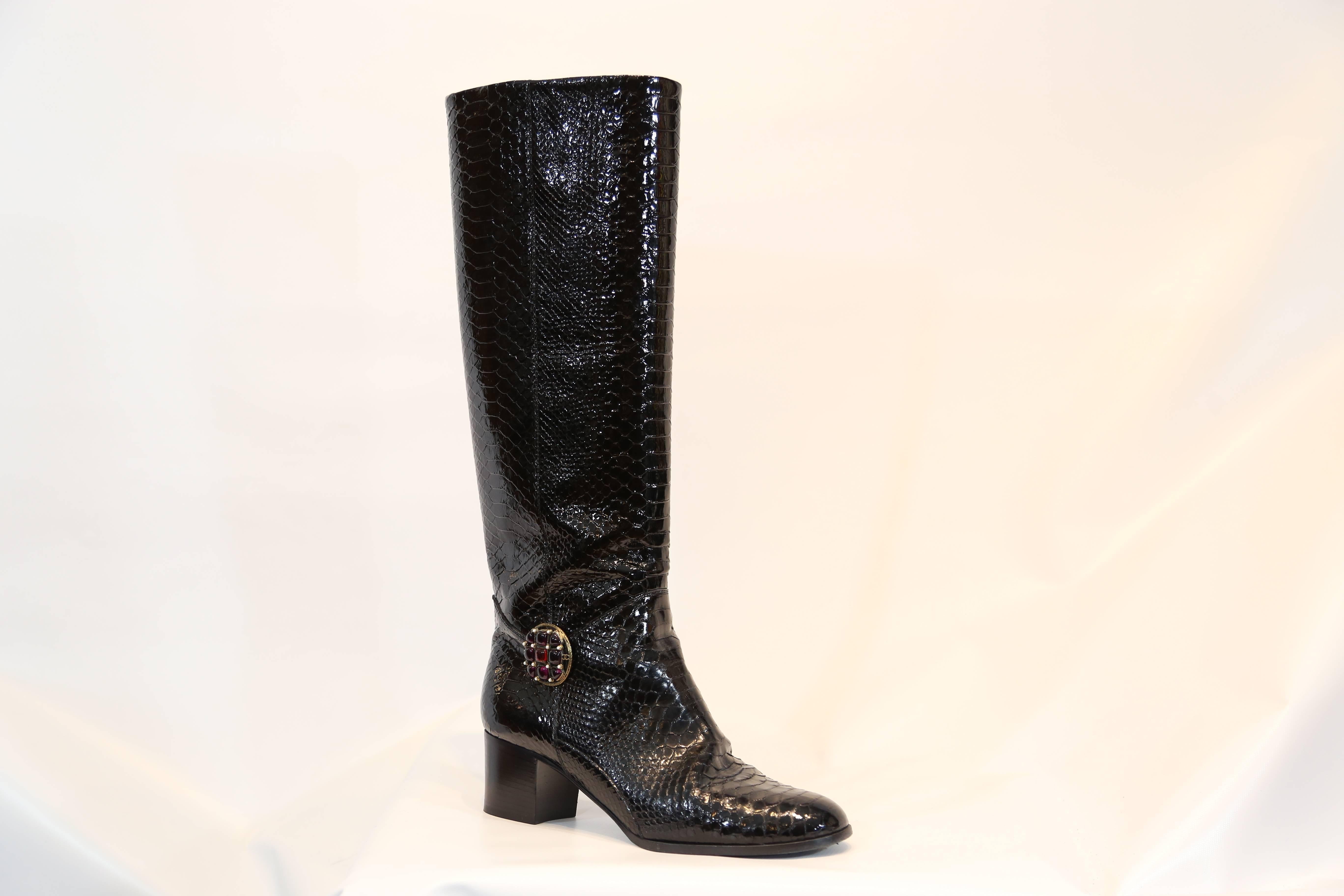 Chanel black python embossed patent leather boots. Jeweled detail on ankle. Knee high boots. 