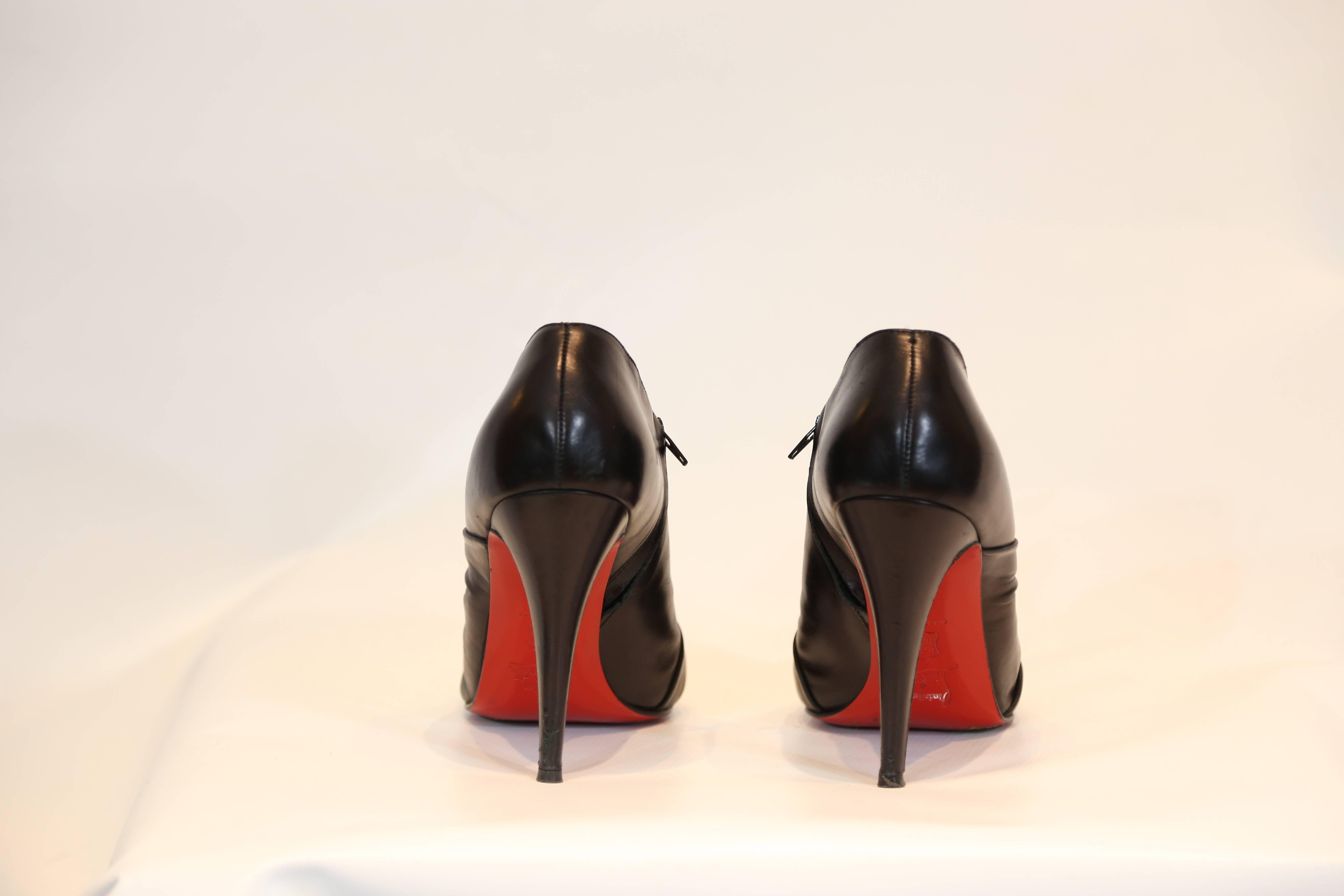 Christian Louboutin Black Leather Ankle Bootie In Excellent Condition In New York, NY