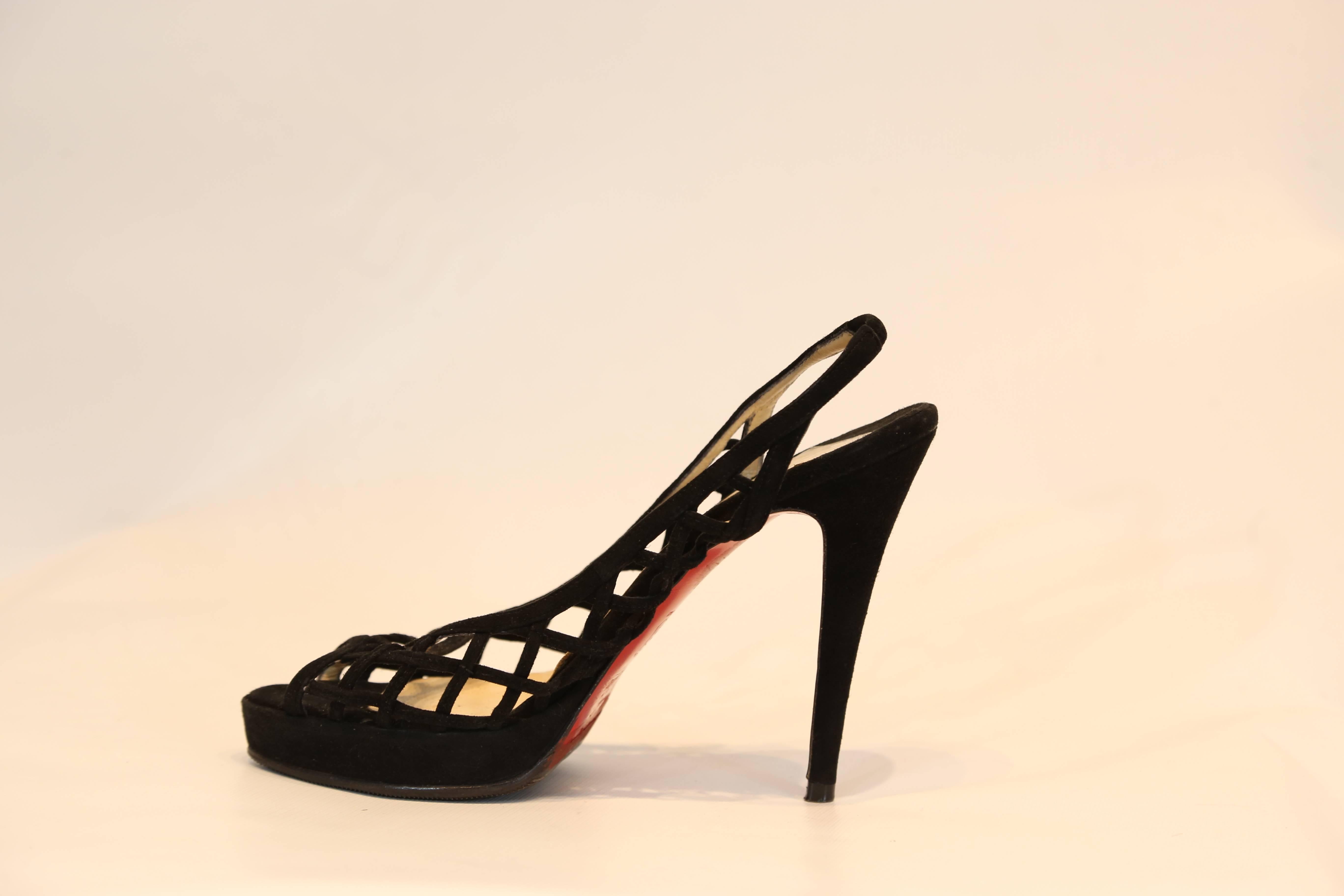 Christian Louboutin black suede slingback with wide cutout detail. 