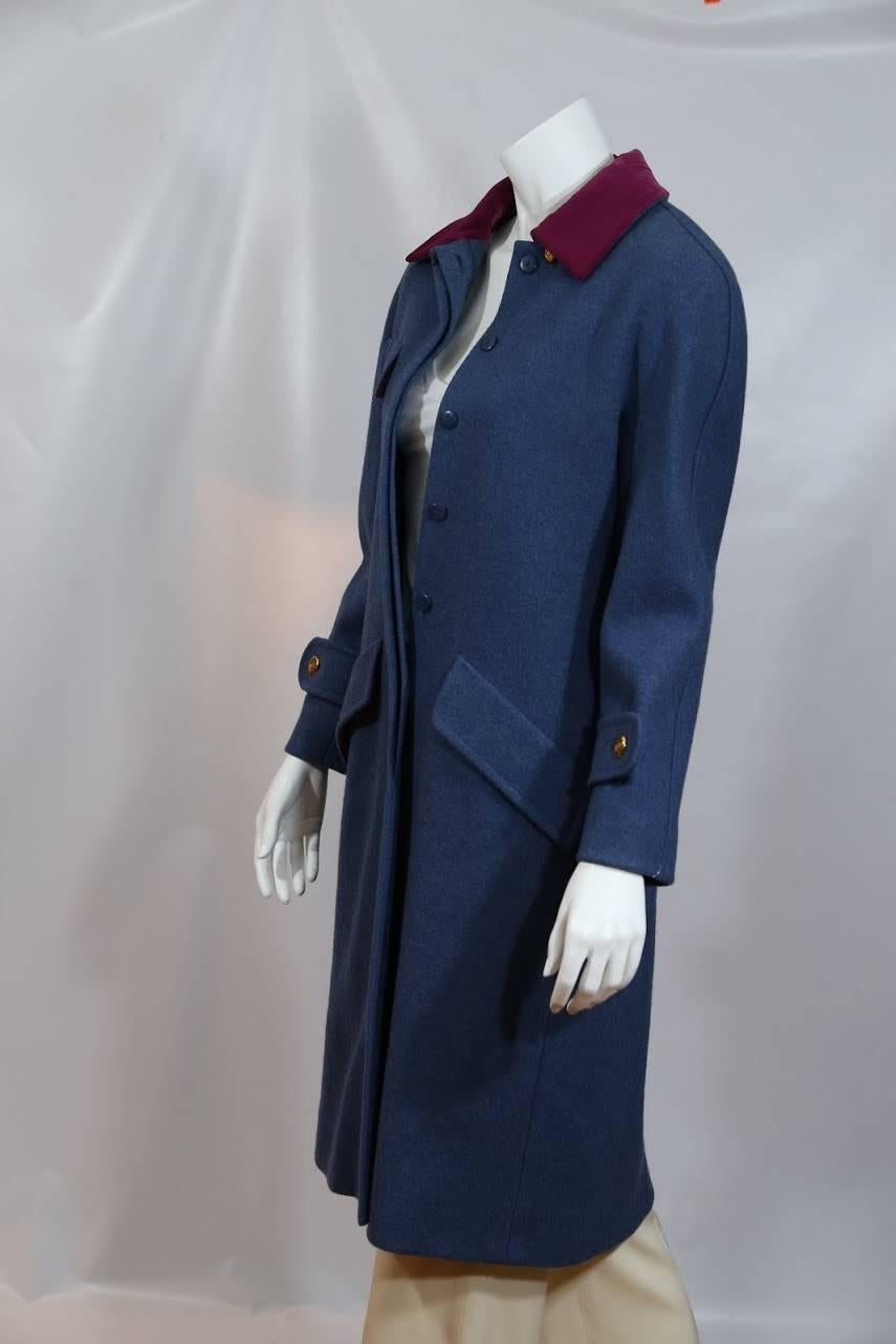 Chanel blue wool jacket with pink collar and signature gold buttons. 