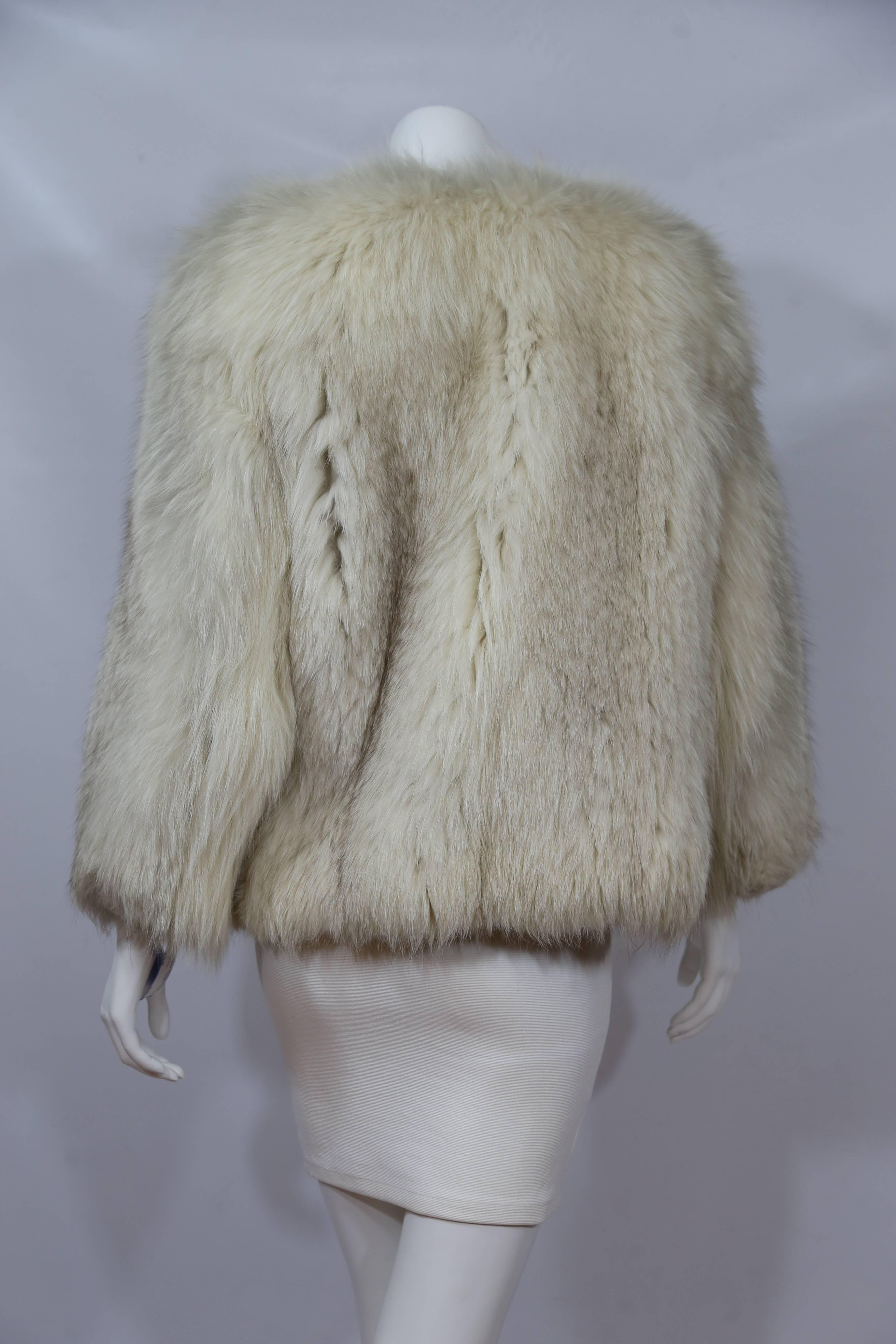 Warm white fox fur coat. 