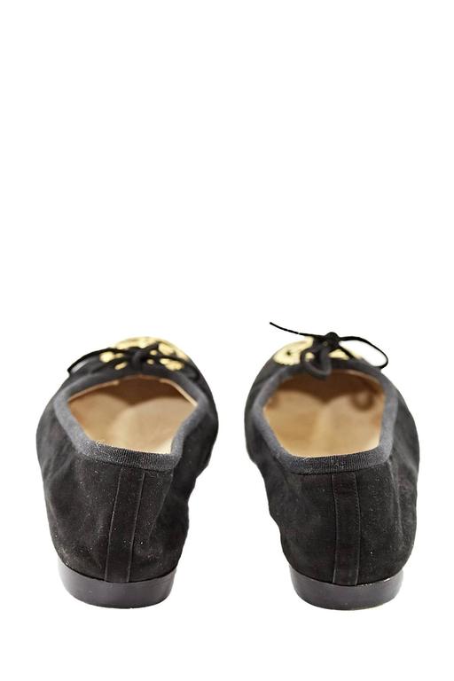 Chanel Black and Gold Suede Emblem Flat Shoes at 1stDibs