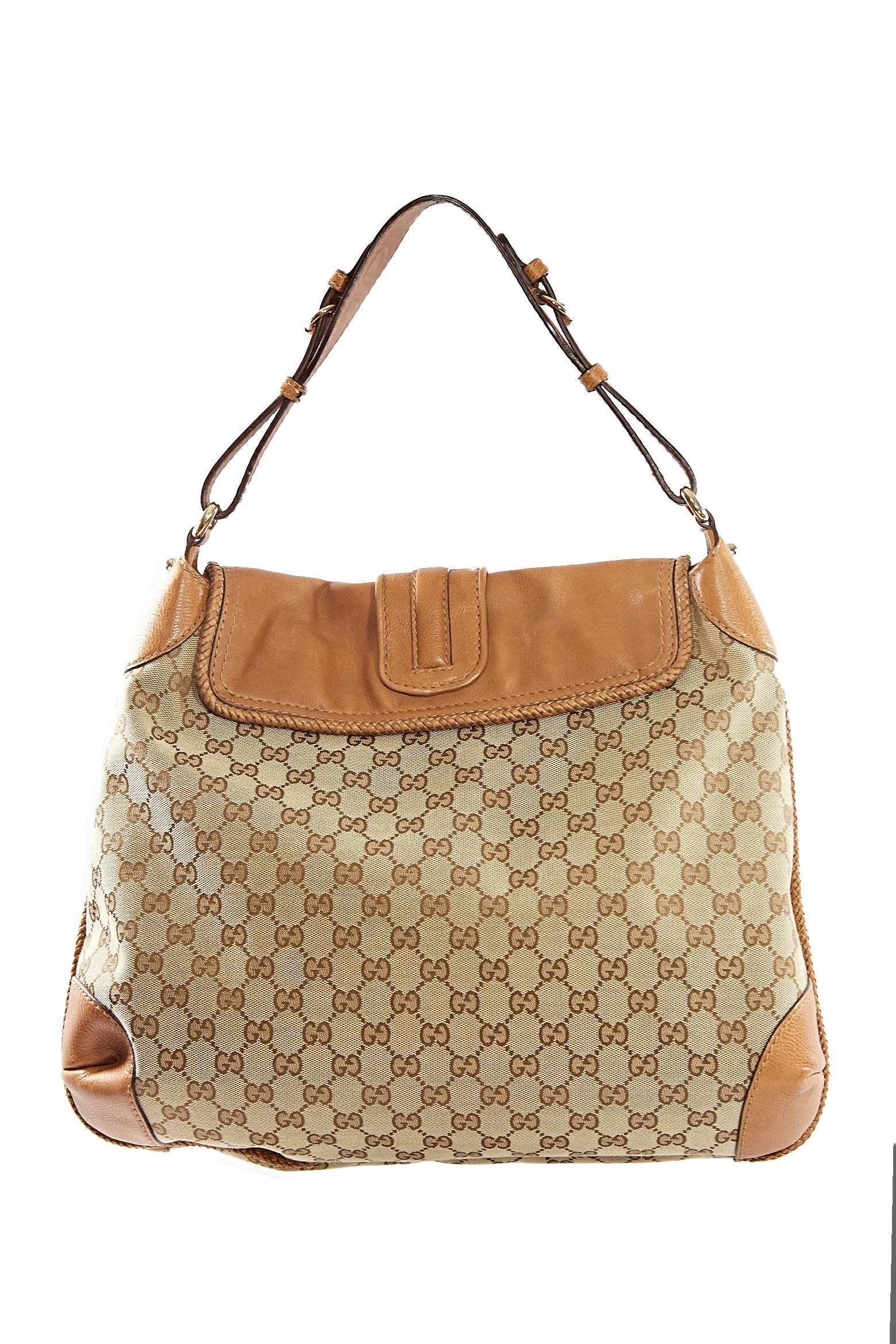 Gucci Tan Canvas Monogram Bag. Tan leather trim, braided detail. Hobo style.
