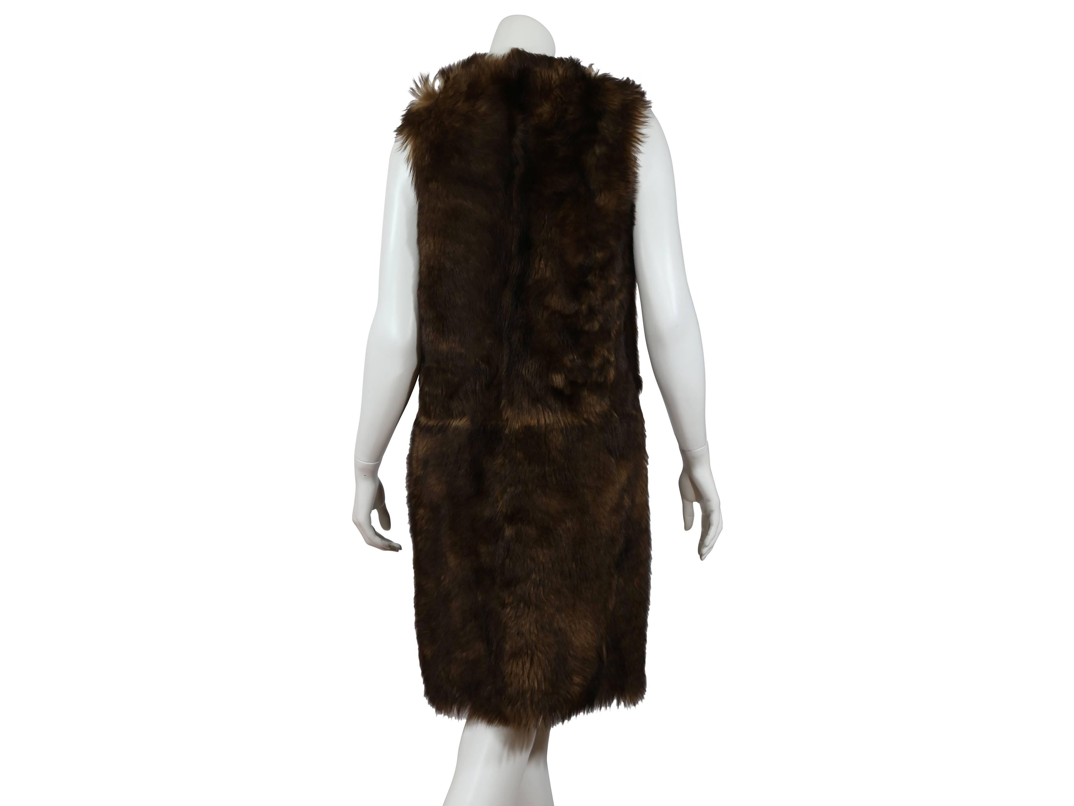 Long lamb shearling vest by Ralph Lauren.  V-neckline.  Sleeveless. Concealed front closure.