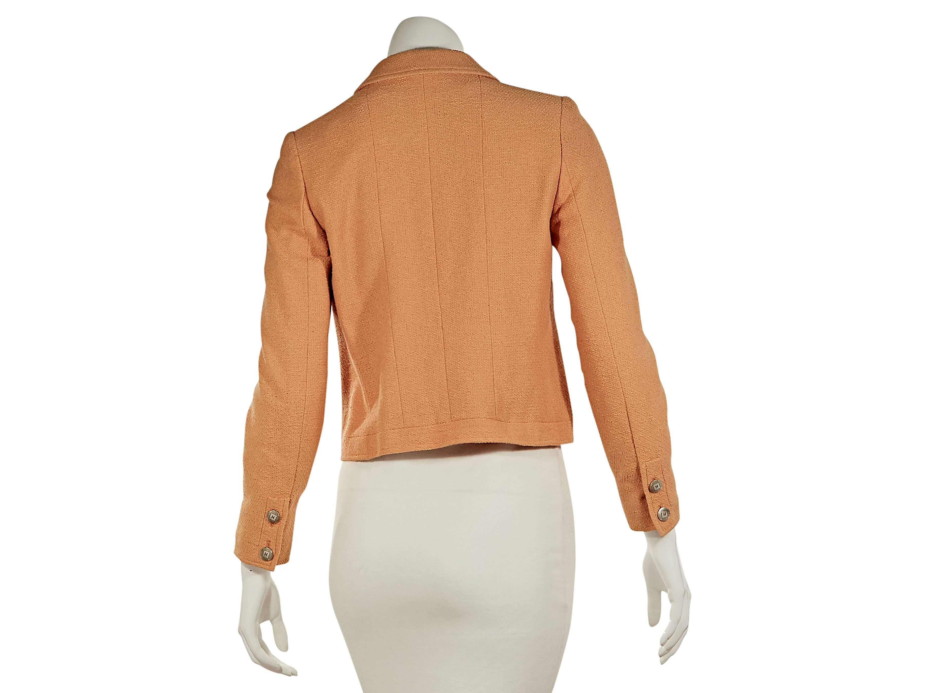   Peach textured cotton jacket by Chanel.  Spread collar.  Bracelet-length sleeves.  Double button cuffs.  Button-front closure.  Button patch pockets. 