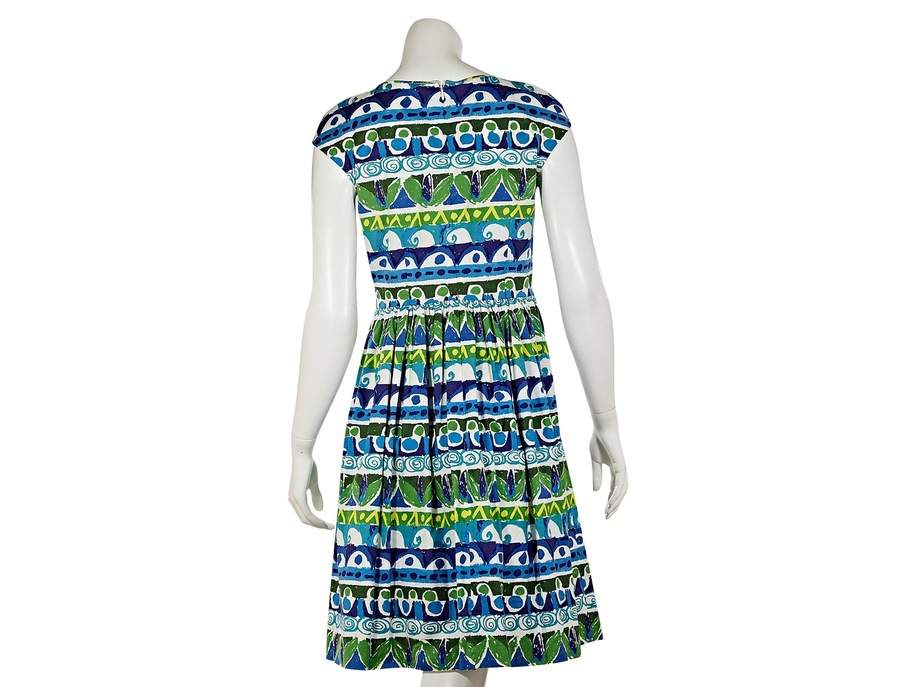 Multicolor printed fit-and-flare dress by Prada.  Scoopneck with smocking.  Cap sleeves.  Concealed back zip closure.  