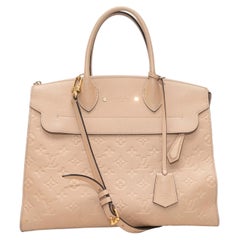 Bolso MM de Louis Vuitton con asa superior, color beige