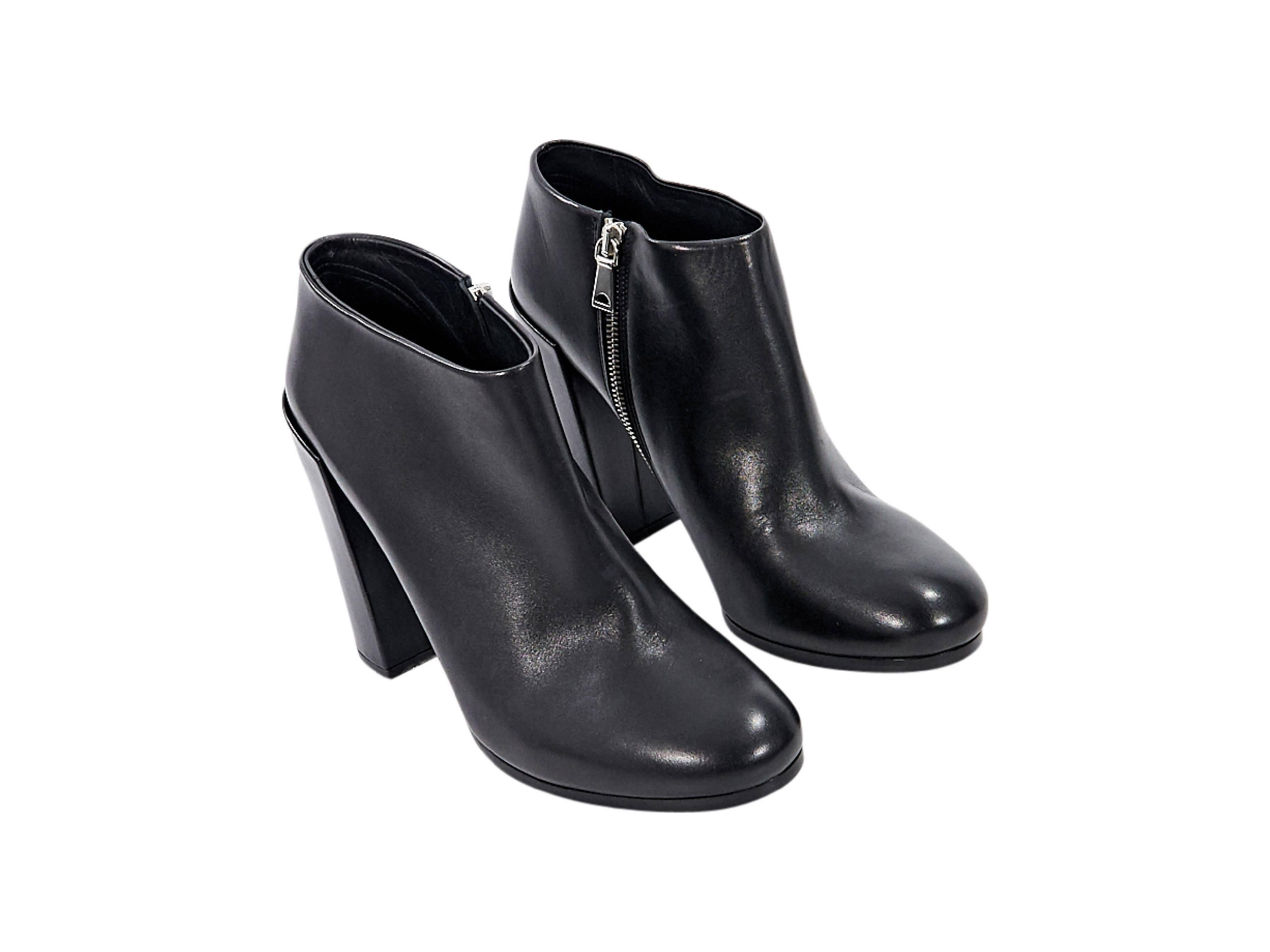 Product details: Black leather ankle boots by Proenza Schouler. Round toe. Block heel. Inner zip closure. 
Condition: Pre-owned. Very good.
Est. Retail: $ 1,495.00