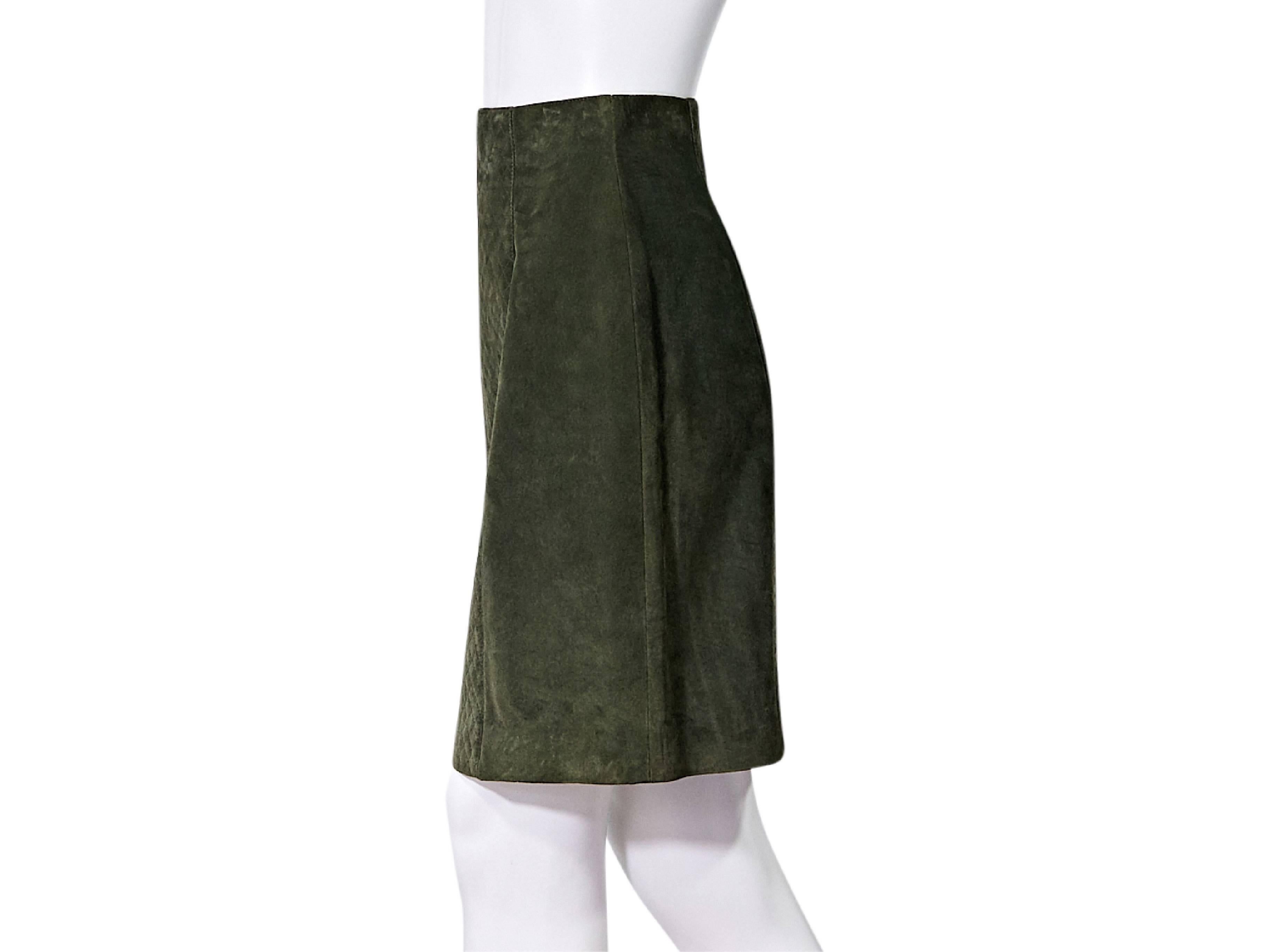 Product details:  Olive green suede pencil skirt by Chanel.  Quilted front panel.  Concealed back zip closure.  Double buttons at back hem.  
Condition: Pre-owned. Very good.
Est. Retail: $ 735.00