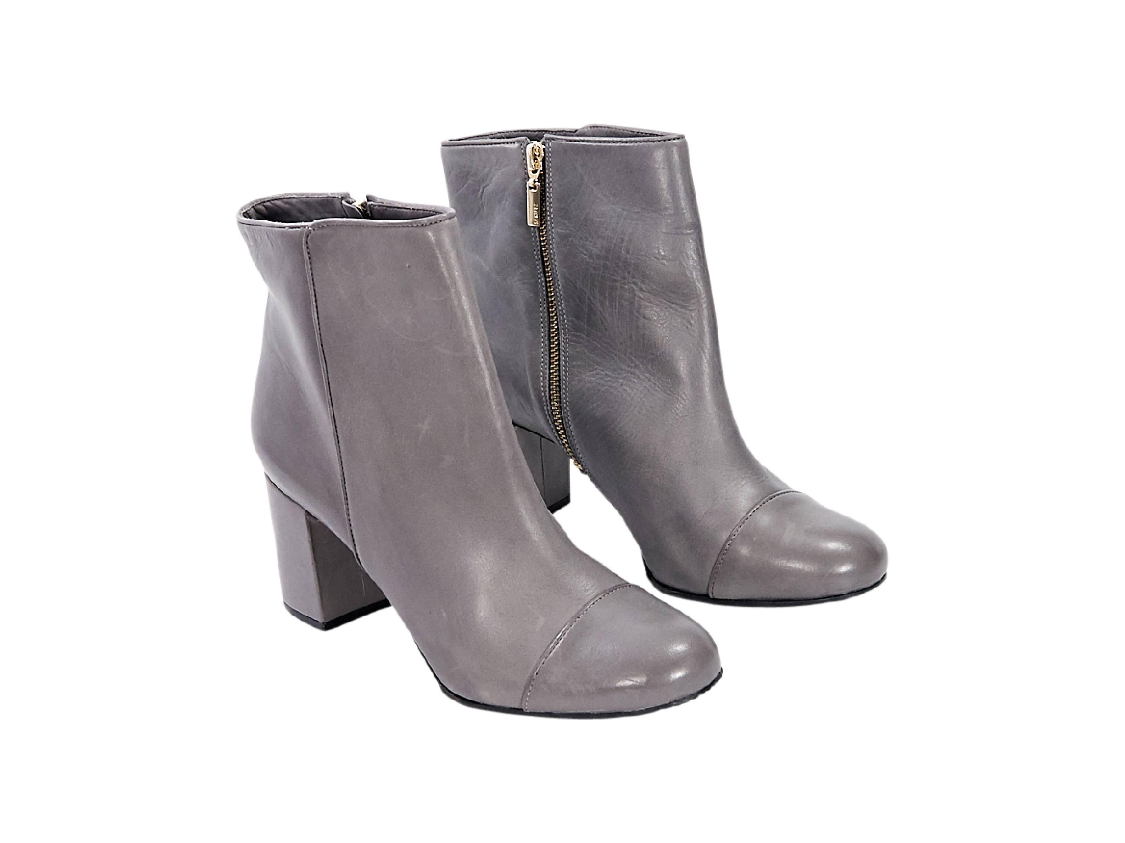 Product details:  Grey leather ankle boots by Schutz.  Inner zip closure.  Round cap toe.  Block heel. 
Condition: Pre-owned. Very good.
Est. Retail $ 598.00
