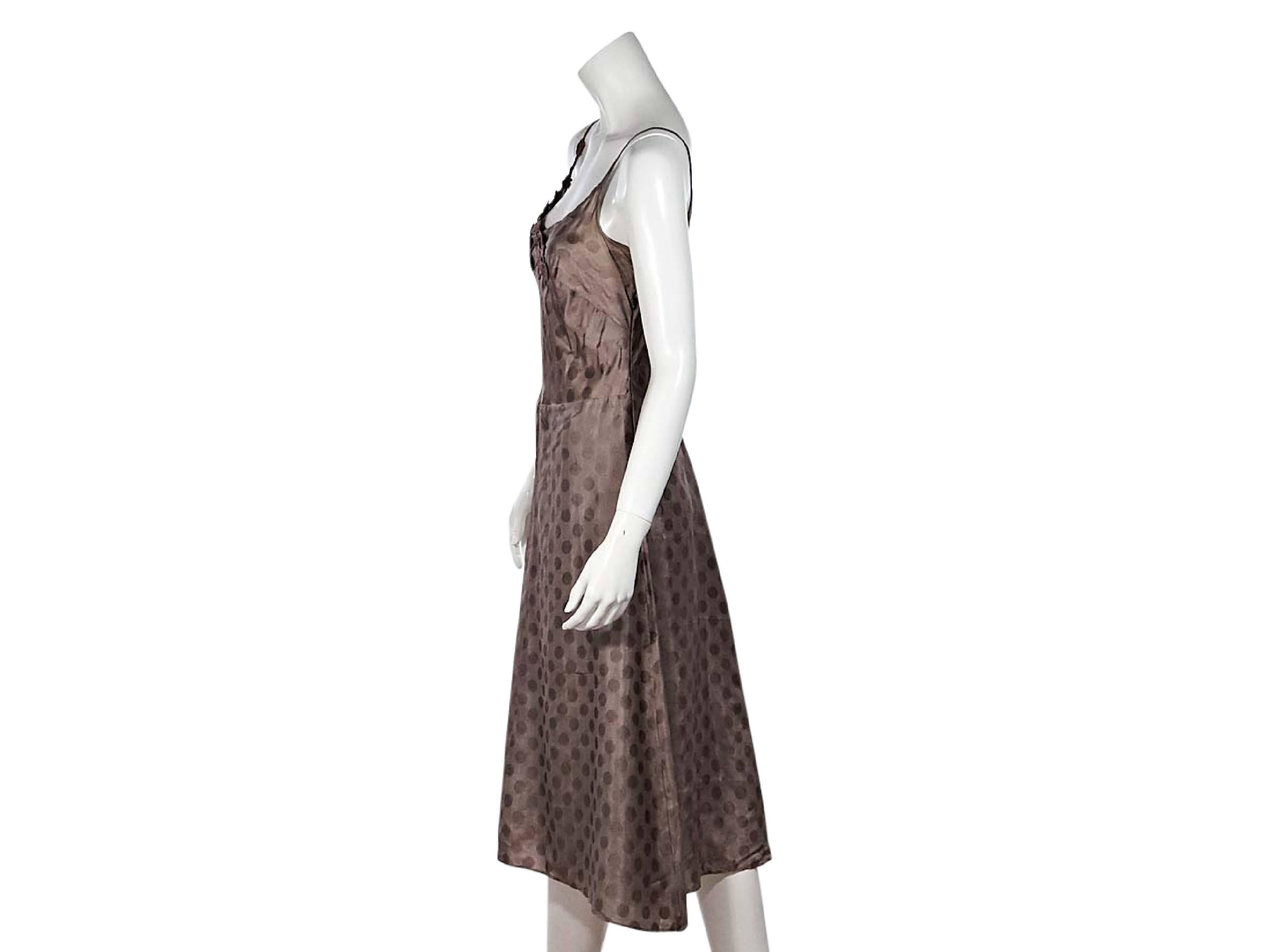 Product details:  Tan tonal polka dot dress by Isabel Marant.  Accented with floral lace.  Sccopneck.  Sleeveless.  
Condition: Pre-owned. Very good.
Est. Retail $ 775.00