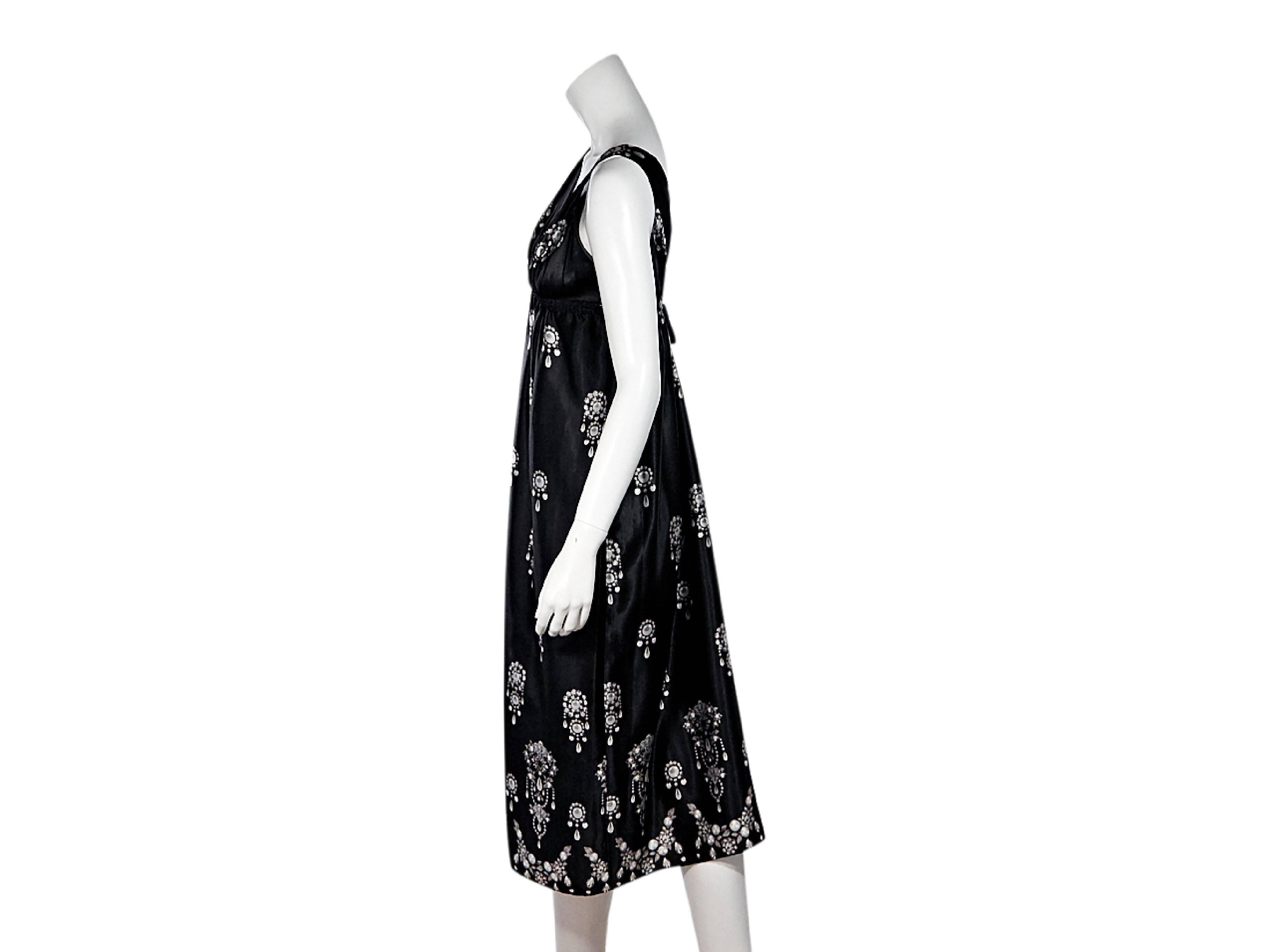 Product details:  Black jewel-printed silk midi dress by Oscar de la Renta.  Double v-neck.  Sleeveless.  Empire waist with self-tie back.  Pullover style.
Condition: Pre-owned. Very good.
Est. Retail $ 998.00