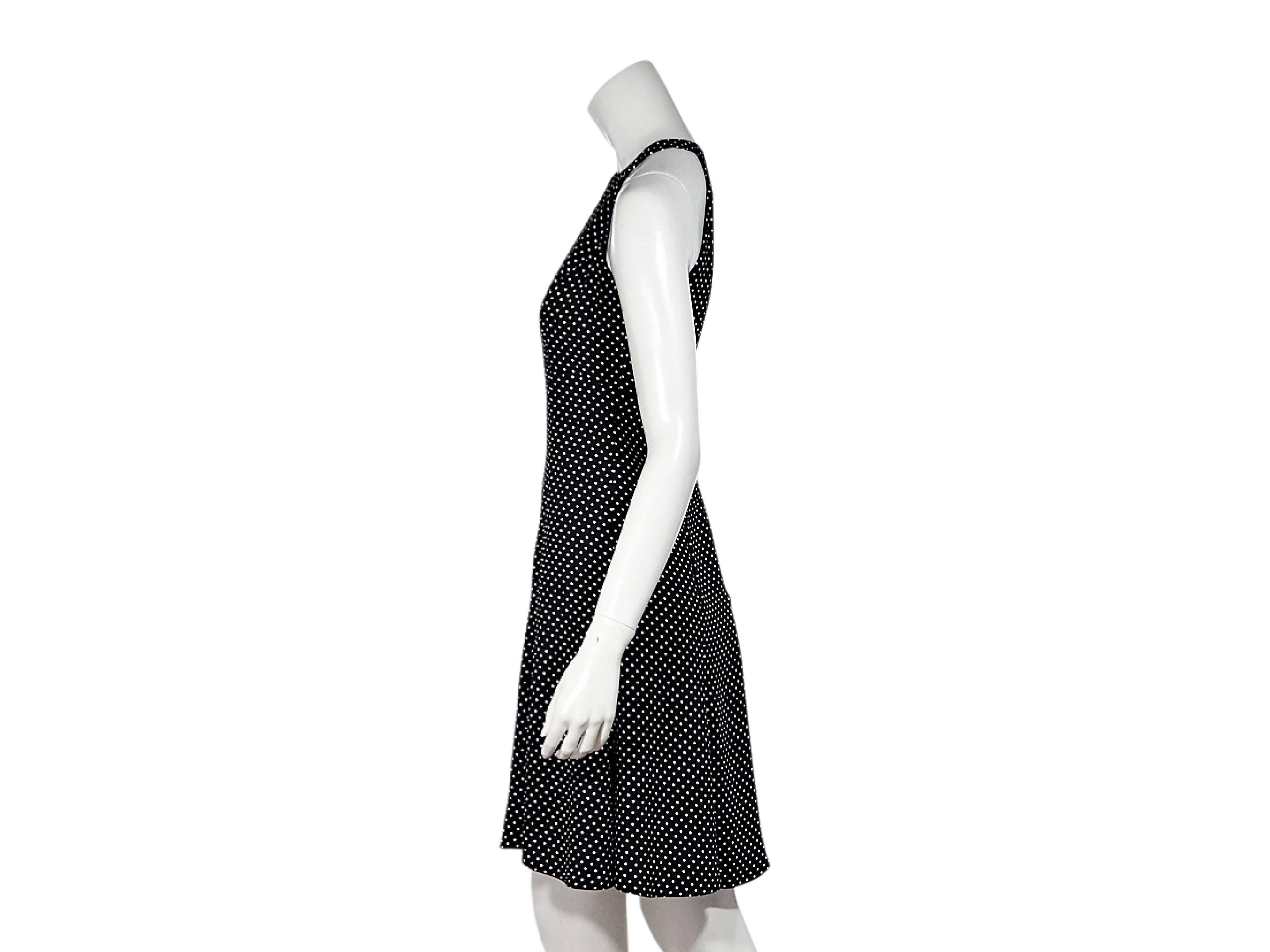 Product details:  Black and white polka-dot printed sheath dress by Michael Kors Collection.  Halter-style neckline.  Sleeveless.  Concealed back zip closure.  Flared skirting.  
Condition: Pre-owned. New with tags  
Est. Retail $ 1,350.00