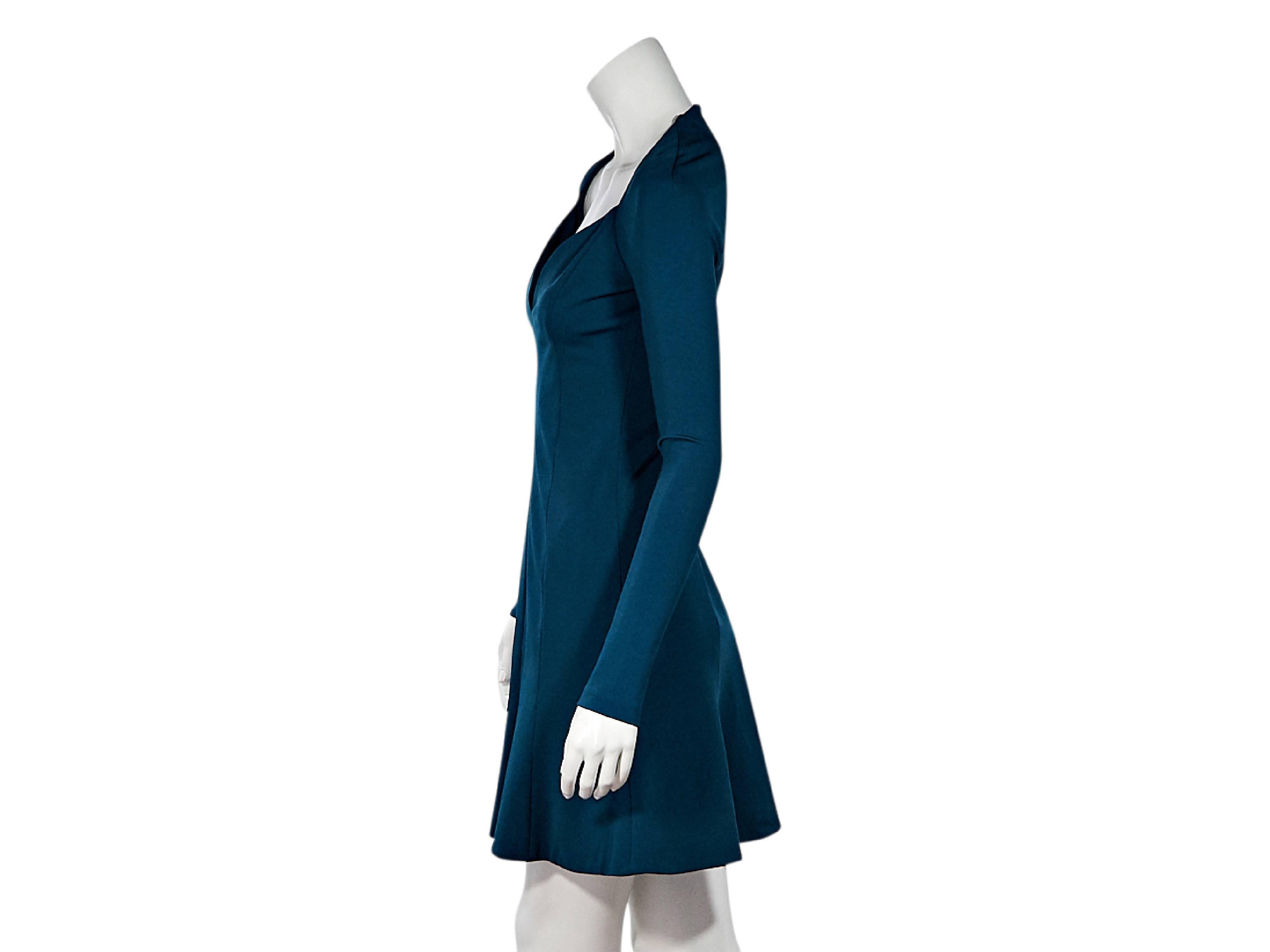 Product details:  Teal long-sleeve mini dress by Cushnie Et Ochs.  Sweetheart neckline.  Long sleeves.  Concealed back zip closure.  Seams create a flattering silhouette. Flared skirting. 
Condition: Pre-owned. Very good.  
Est. Retail $ 1,395.00