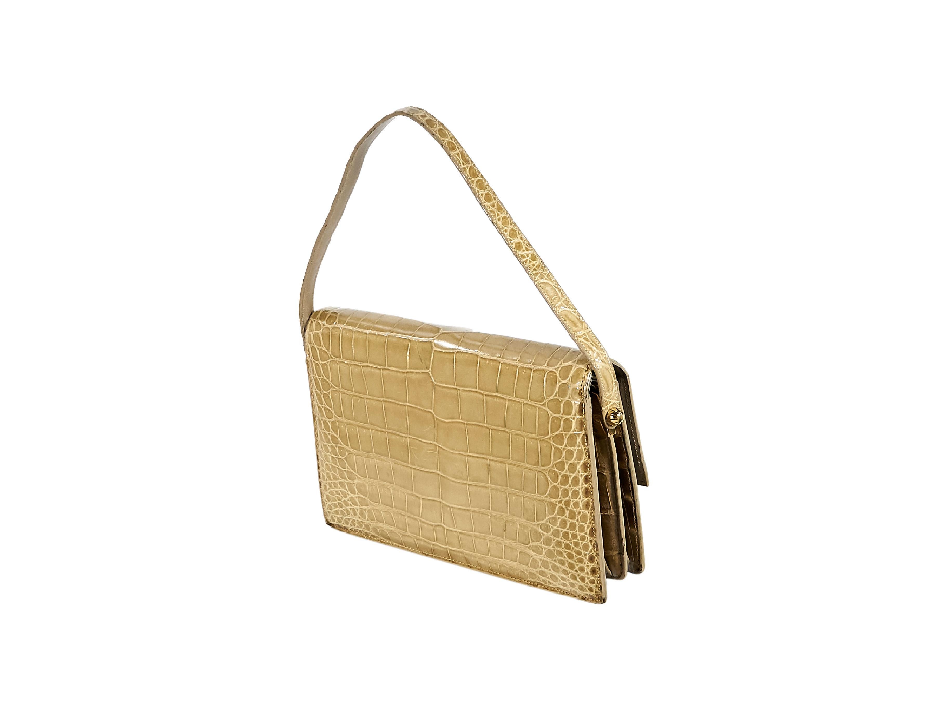 Product details:  Vintage tan alligator belly shoulder bag by Lucille de Paris.  From the 1950s/1960s.  Single shoulder strap.  Front flap with flip-lock closure.  Lined interior with center zip compartment and inner slide and zip pockets.  Goldtone