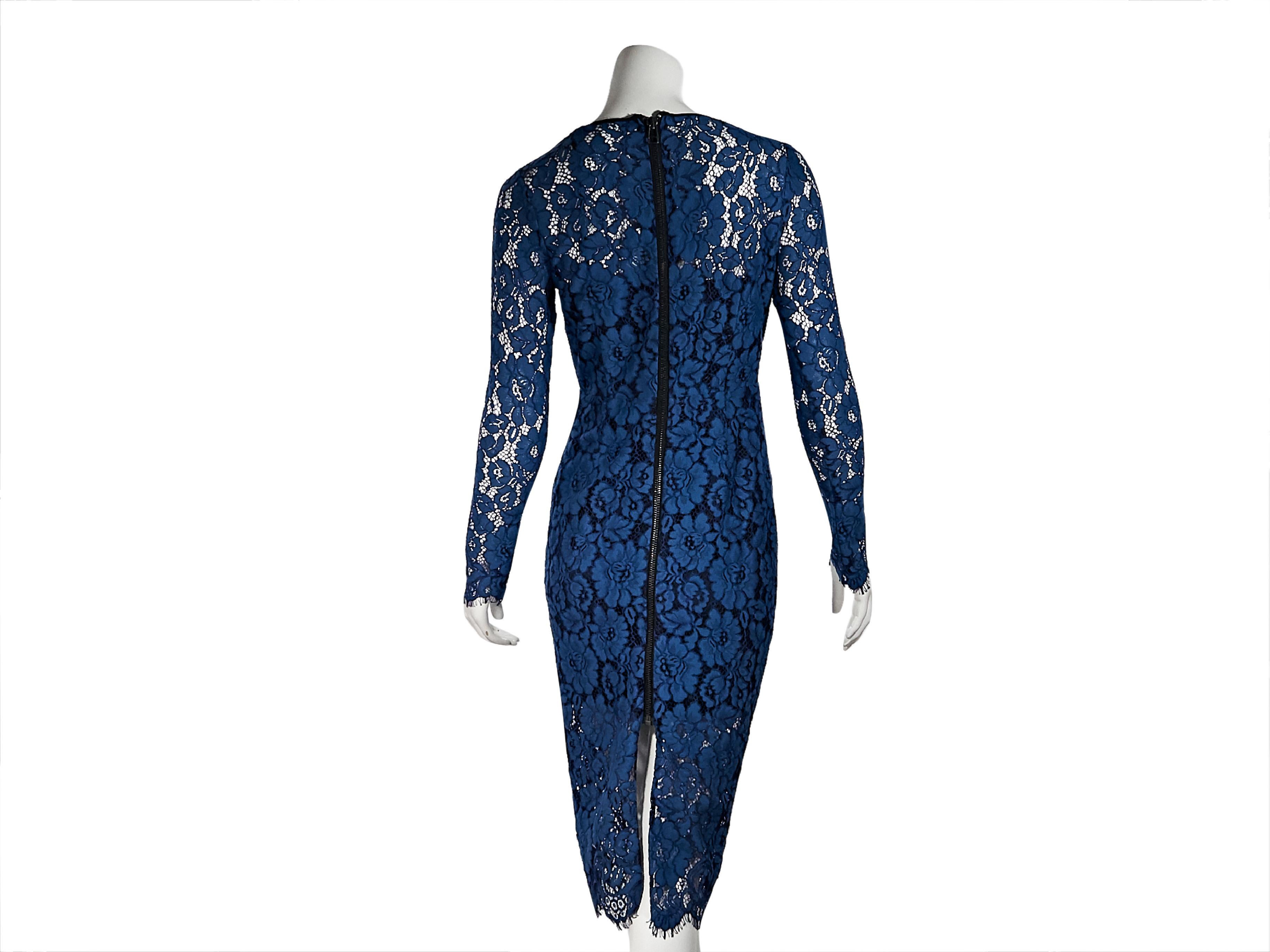 Product details:  Blue lace sheath dress by Veronica Beard.  Jewelneck.  Long sleeves.  Exposed back zip closure.  Slip lining.  Back center hem slit.  30