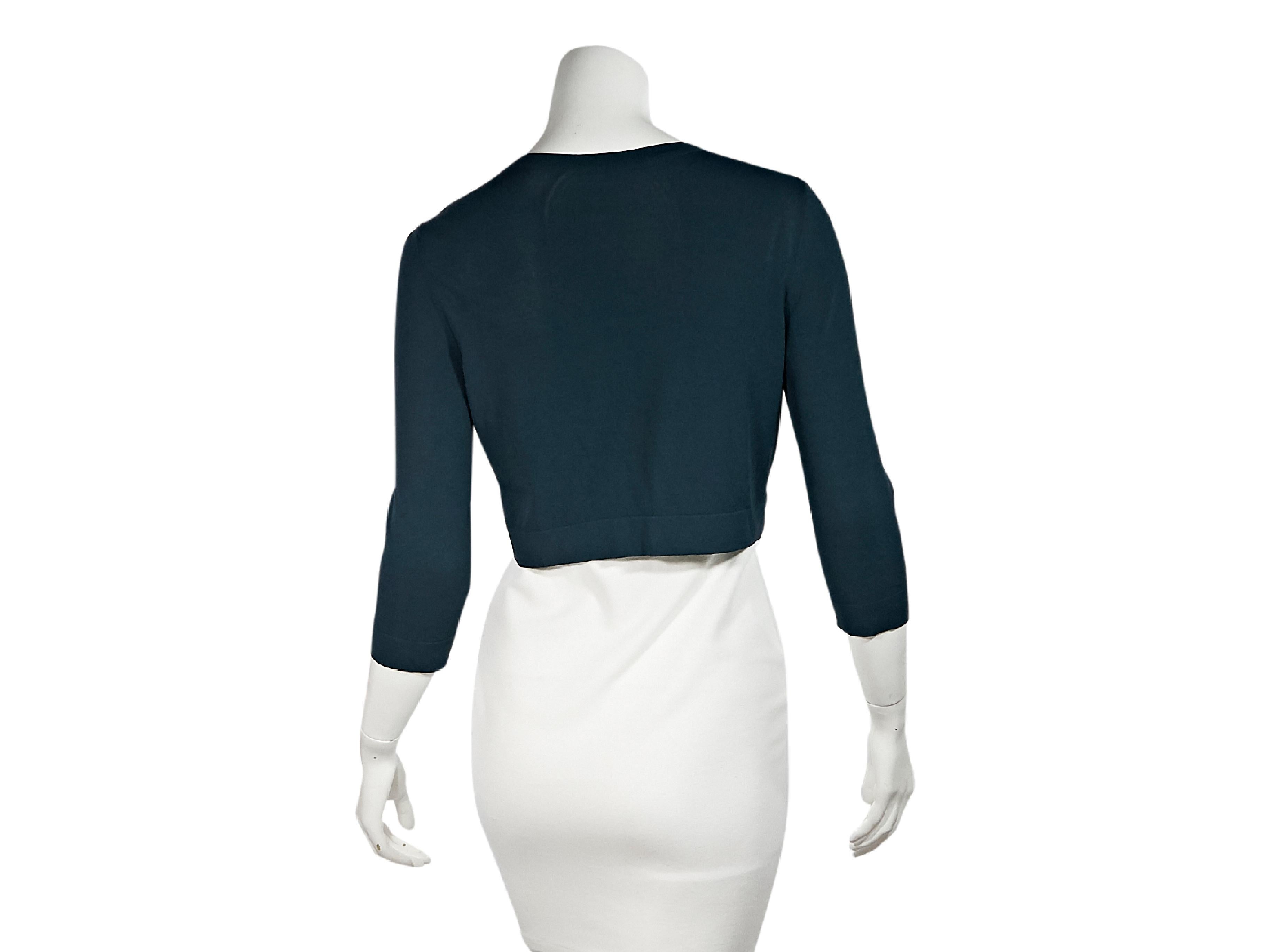 Product details:  Teal blue cropped cardigan by Alaia.  Jewelneck.  Three-quarter length sleeves.  Banded cuffs and hem.  Button-front closure.  34