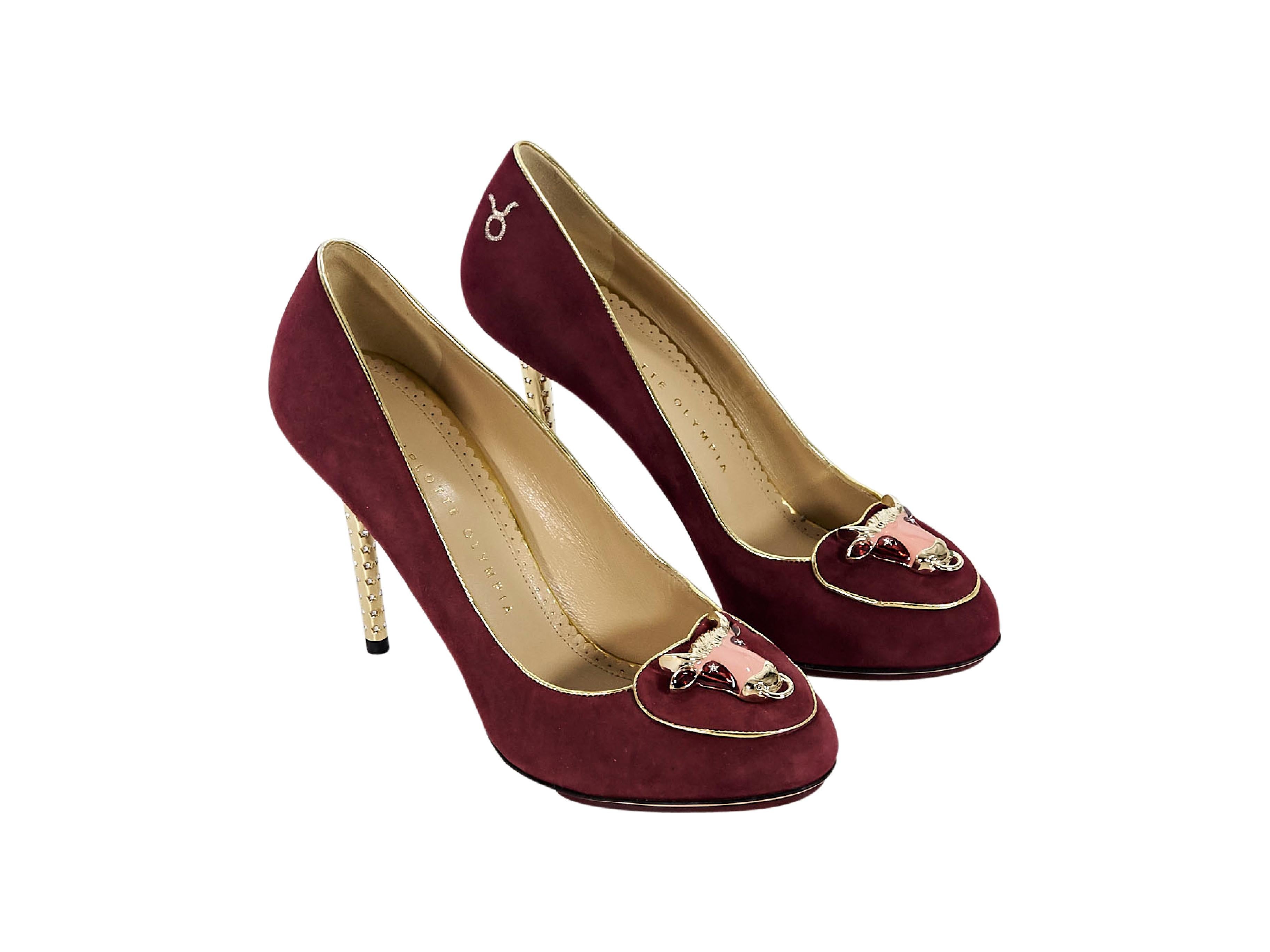 Product details:  Burgundy suede Taurus pumps by Charlotte Olympia.  Taurus embellishment accents vamp.  Goldtone crystal-accented stiletto heel.  Dust bag and original box included.  4