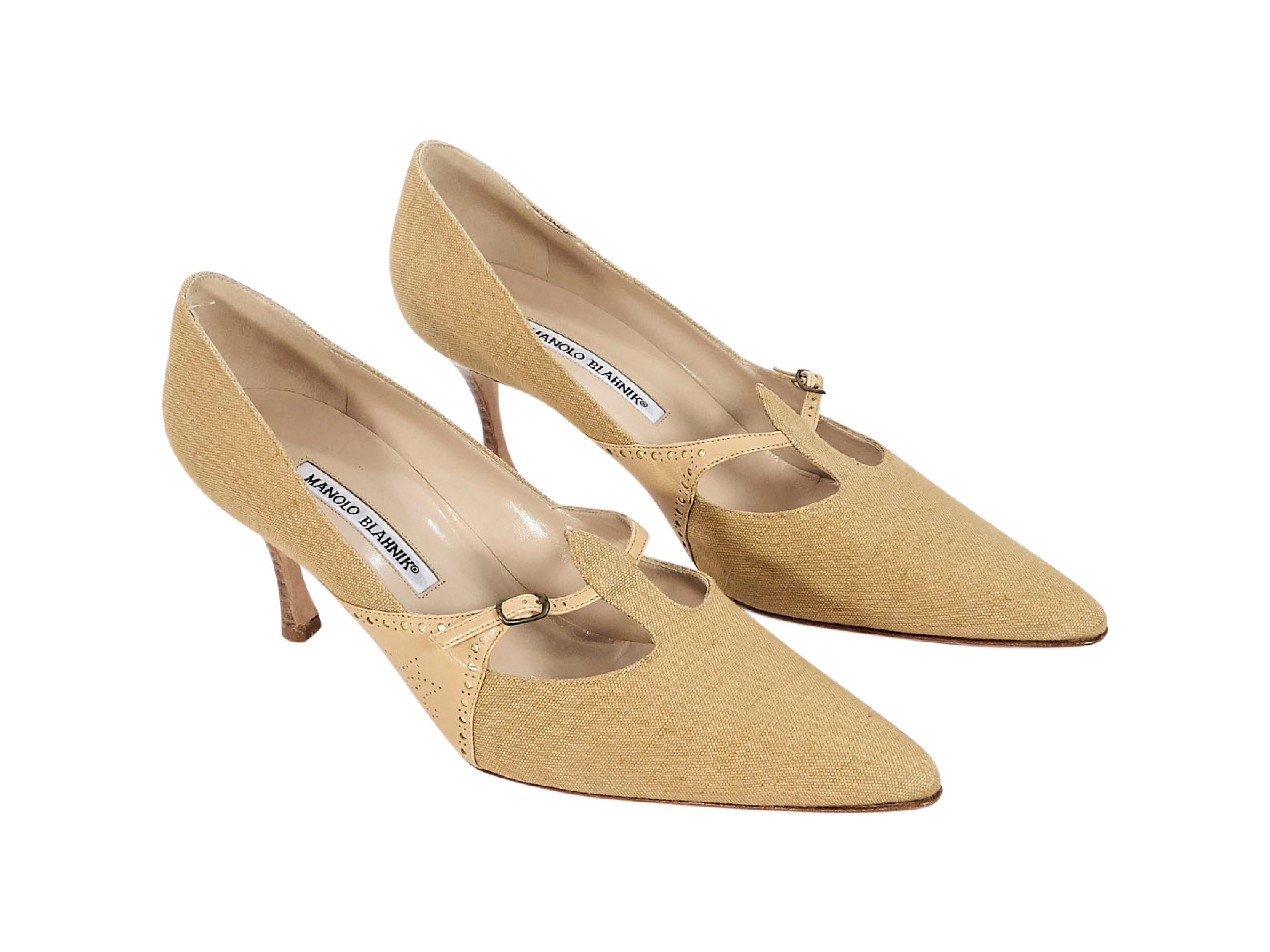 Product details:  Tan woven pumps by Manolo Blahnik.  Trimmed with leather.  Adjustable T-strap closure.  Point toe.  Stacked heel.  Silvertone hardware.  3