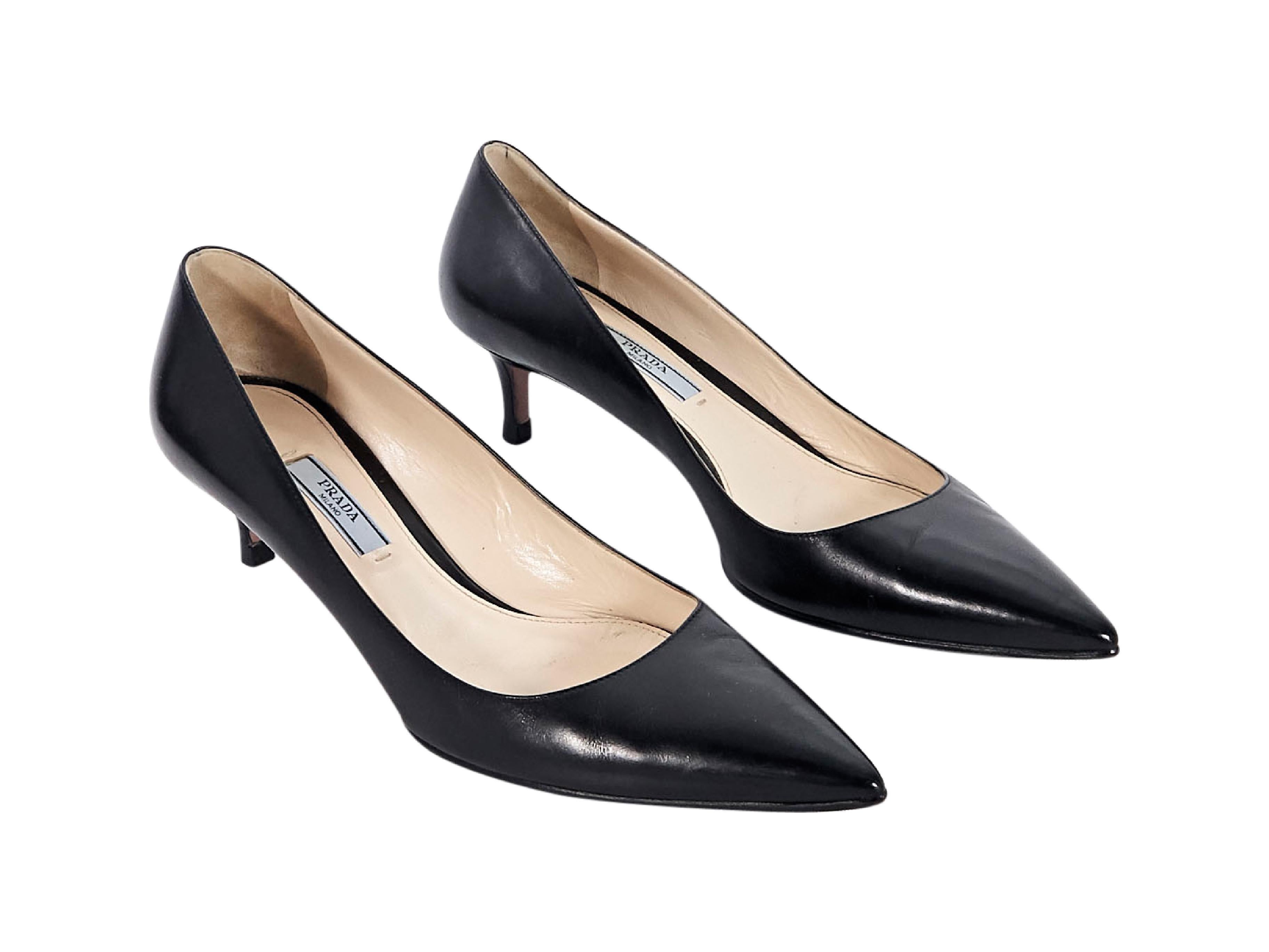 Product details:  Black leather kitten heel pumps by Prada.  Point toe.  Slip-on style.  2