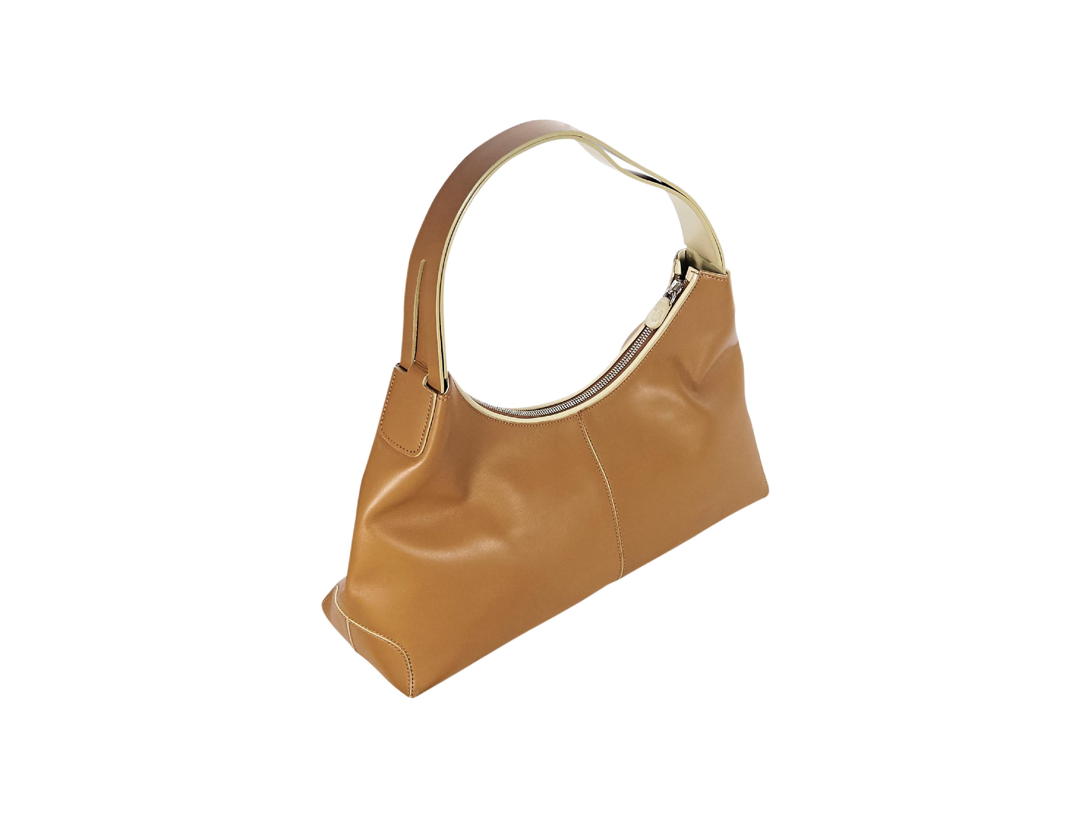 Product details:  Brown leather shoulder bag by Tod's.  Single shoulder strap.  Top zip closure.  Lined interior with inner zip pocket.  Silvertone hardware.  15