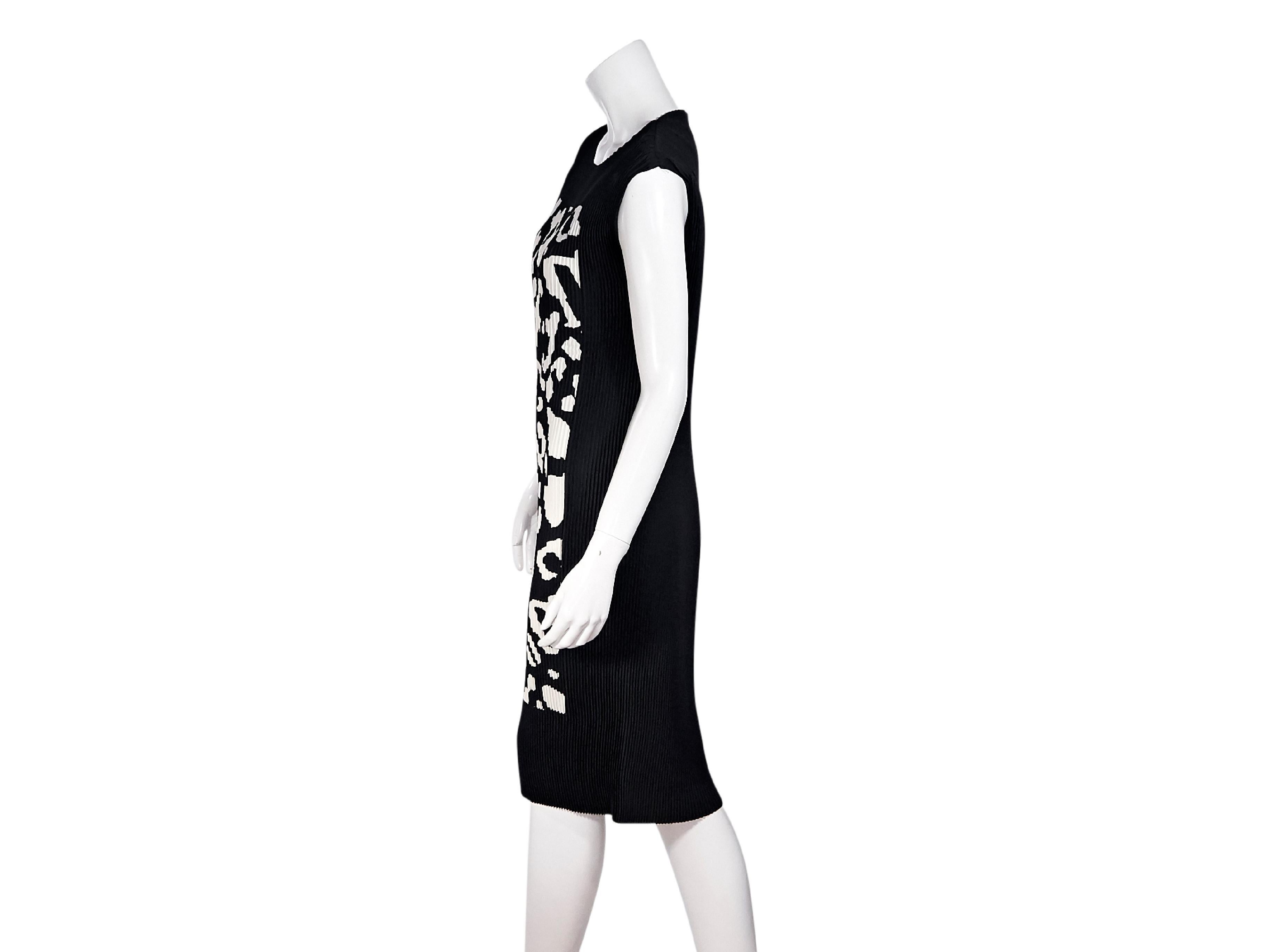 Product details:  Black and white printed pleated shift dress by Escada.  Wide jewelneck.  Cap sleeves.  Printed-front design.  Pullover style.  36
