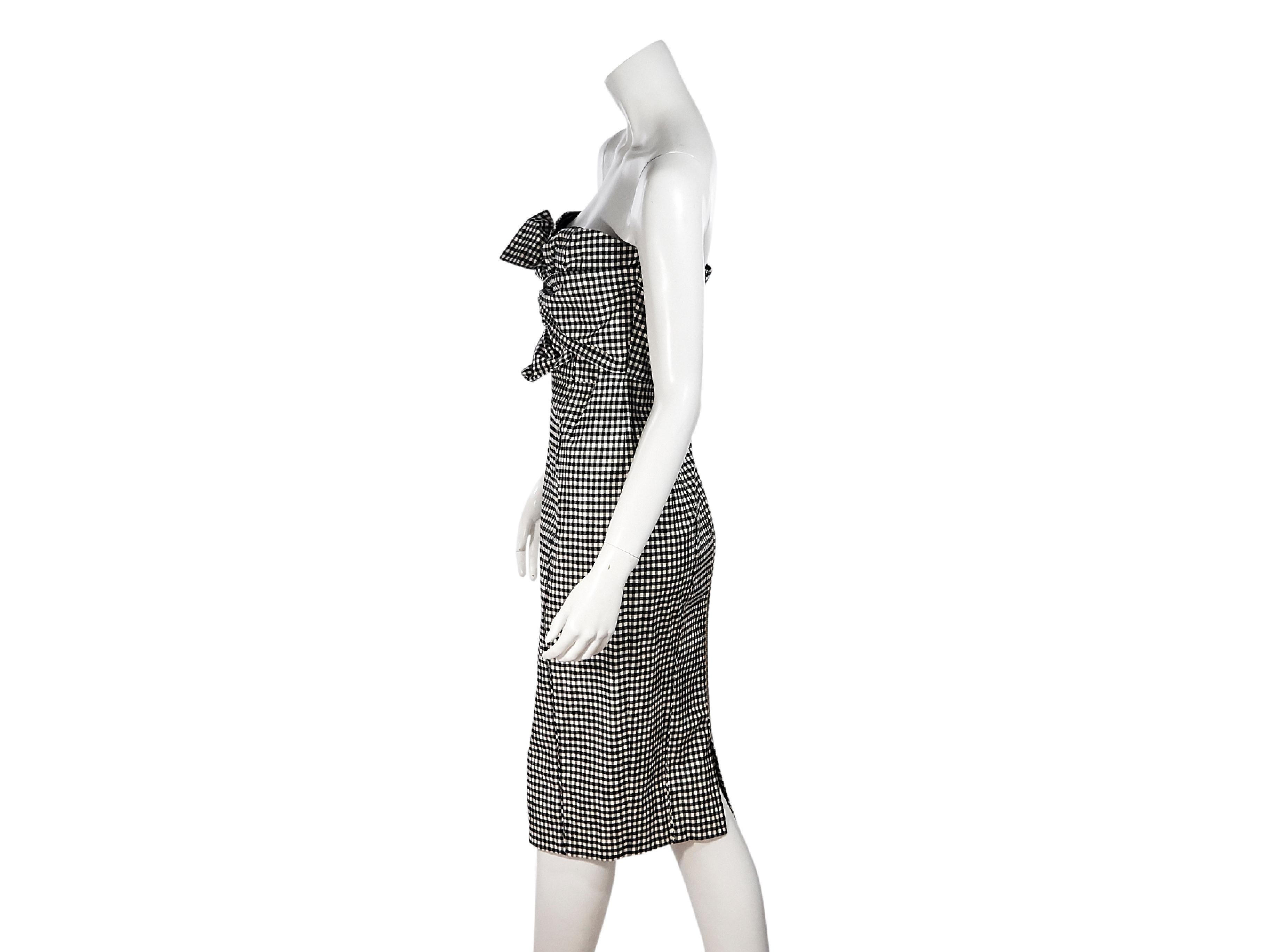 Product details:  Black and white cotton gingham Birdie Bow strapless dress by Veronica Beard.  Sweetheart neckline.  Tie-front detail at bodice.  Exposed back zip closure.  Back hem slit.  30