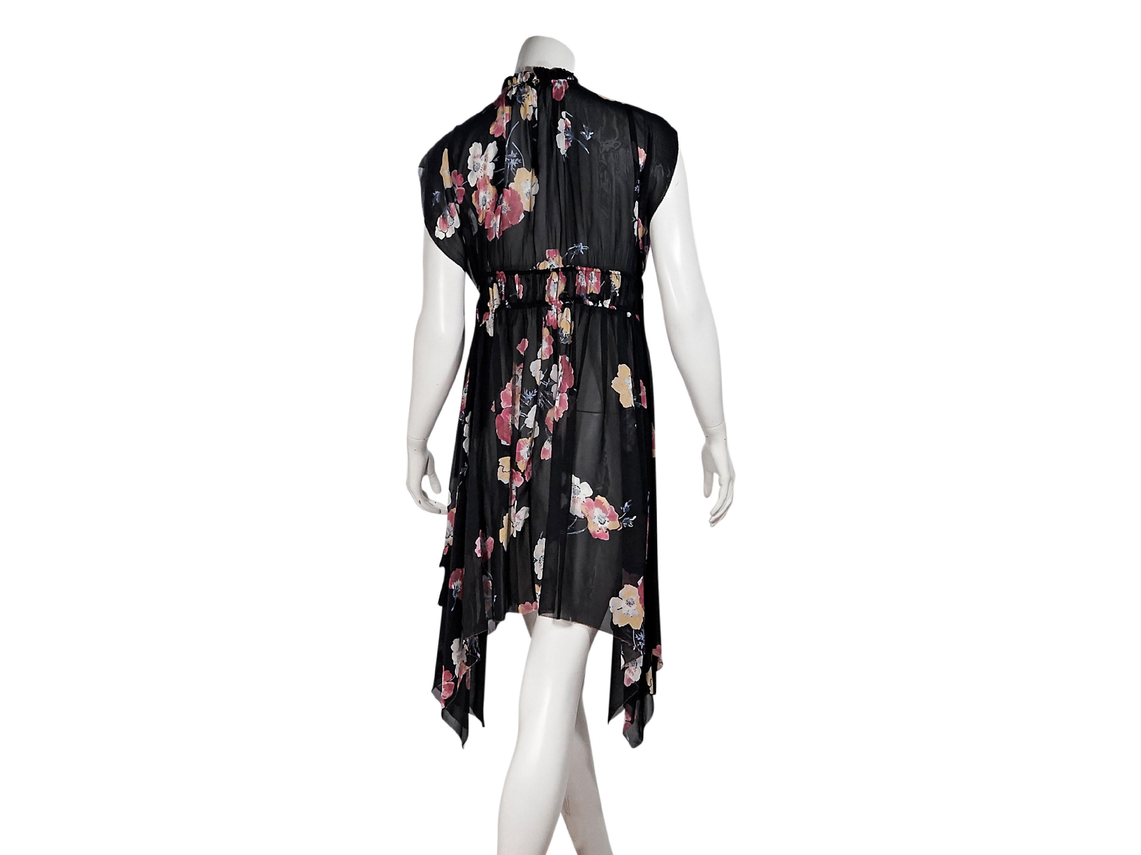 Product details:  Multicolor floral-printed dress by Ulla Johnson.  Stand collar.  Cap sleeves.  Banded waist.  Button back closure.  Sharkbite hem.  33