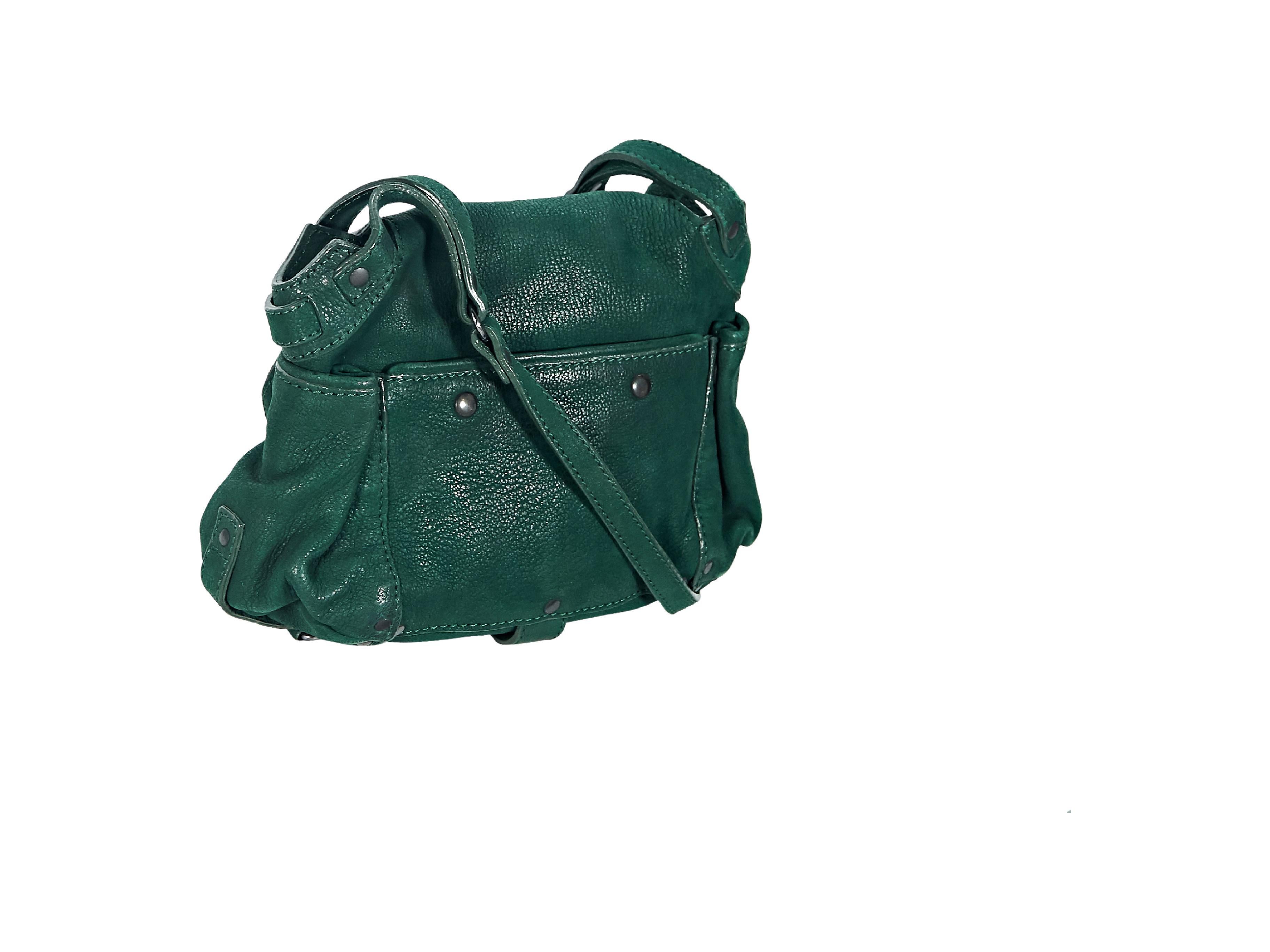 Product details:  Green leather Twee mini crossbody bag by Jerome Dreyfuss.  Adjustable crossbody strap.  Front flap with concealed zip pocket.  Concealed magnetic snap closure.  Lined interior with inner mirror, inner slide pocket and attached