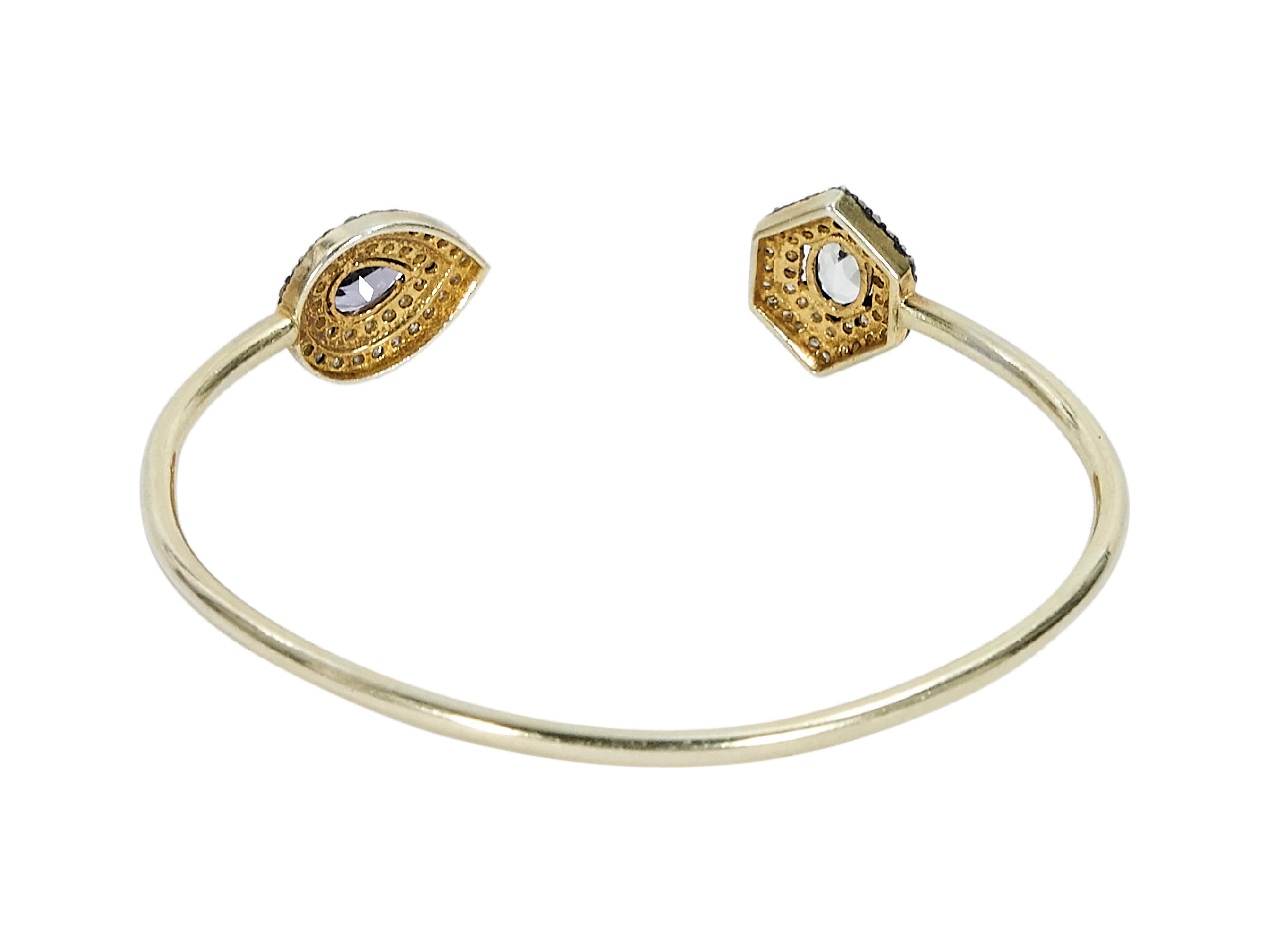 Product details:  Goldtone cuff bracelet by Jennifer Miller.  Crystal embellished ends.  7.5